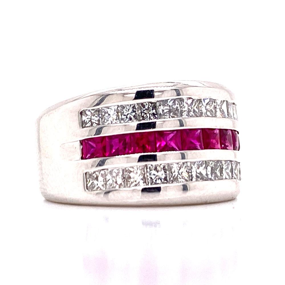 Stunning wide diamond ruby band fashioned in 18 karat white gold. The band features two rows of  24 princess cut diamonds weighing approximately 1.00 carat total weight. The brilliant diamonds are graded G-H color and SI clarity. 10 princess cut