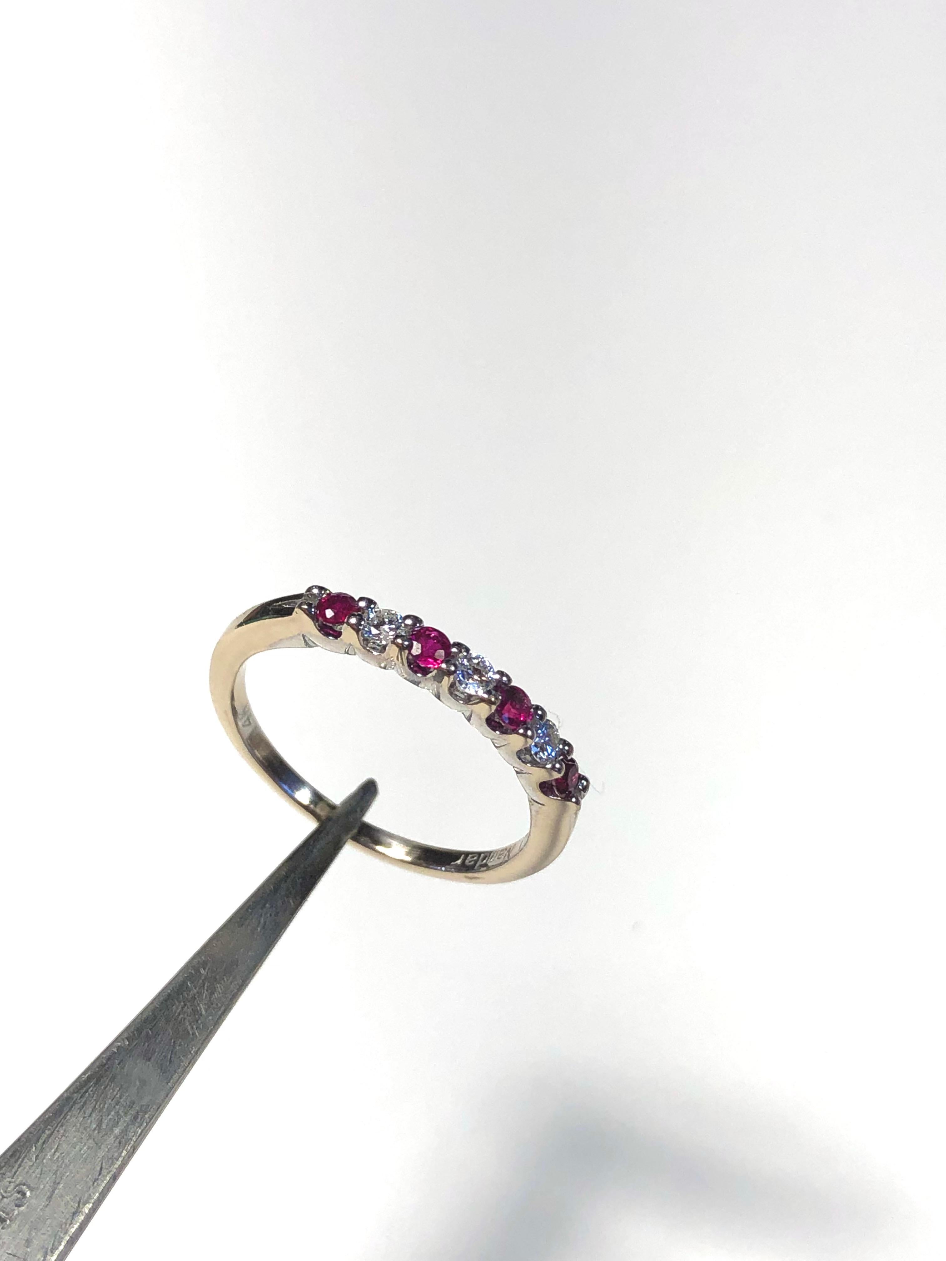 Estate Diamond and Ruby Wedding Band Ring 
Size 6.25 
Metal: 14K white gold 
Weight: 2 grams. The band is 2mm wide
3 Round Diamonds approx. 0.15ctw G-VS
4 Round Rubies approx. 0.24ctw 
This is an estate piece /in excellent condition