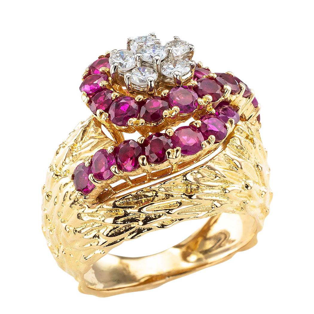 Estate ruby diamond and gold cluster ring circa 1970.

DETAILS:
GEMSTONES:  twenty-two round faceted rubies totaling approximately 2.00 carats.

DIAMONDS:  six round brilliant-cut diamonds weighing approximately 0.40 carat, approximately H color VS