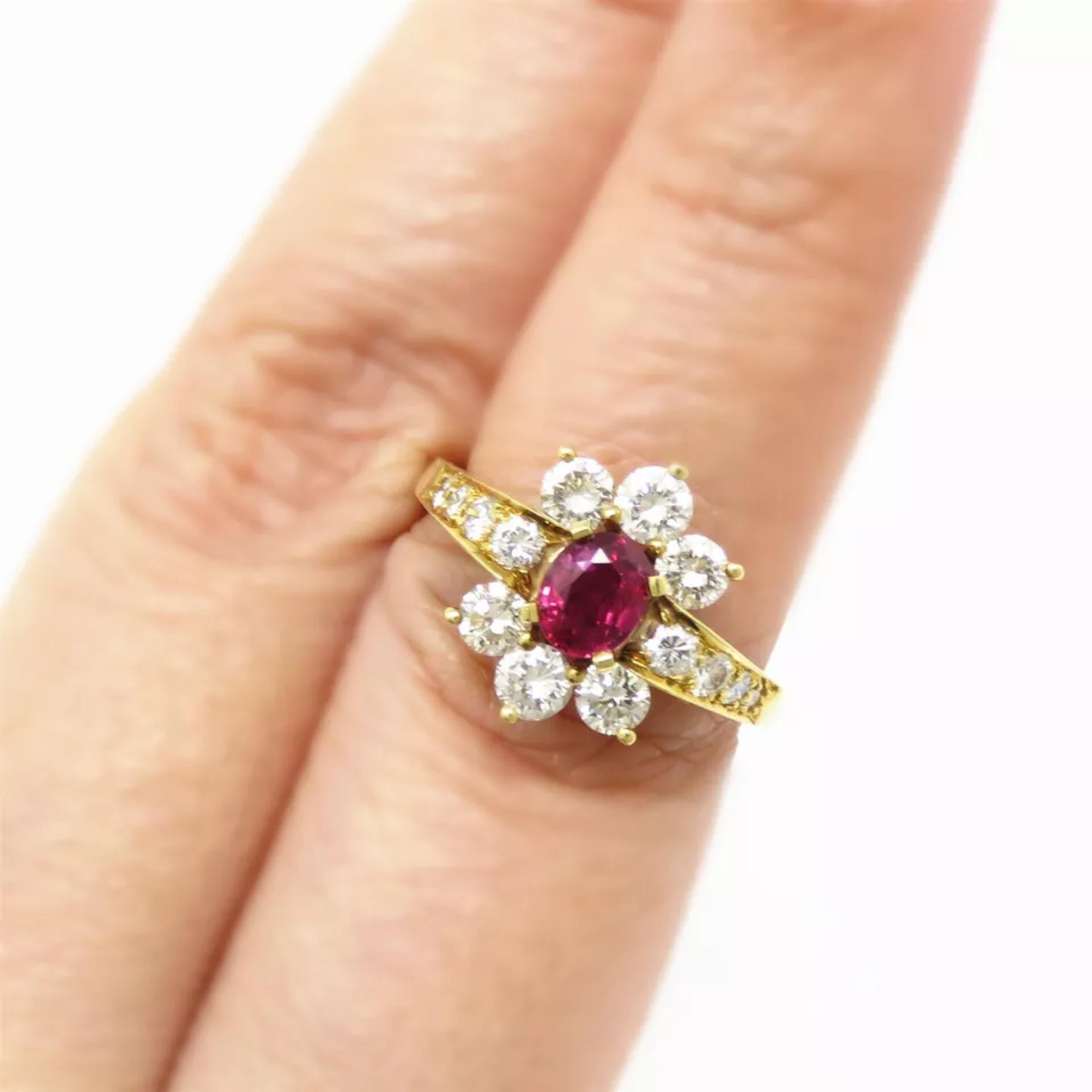 14 Diamonds in total

Natural ruby 5.5 x 4.5 x 2.5mm, approx 0.5ct

Marked: KW 18k 701 40205

Ring top 14mm wide. Ring size 6.25 (Sizable)

Total Weight: 4.5 grams
