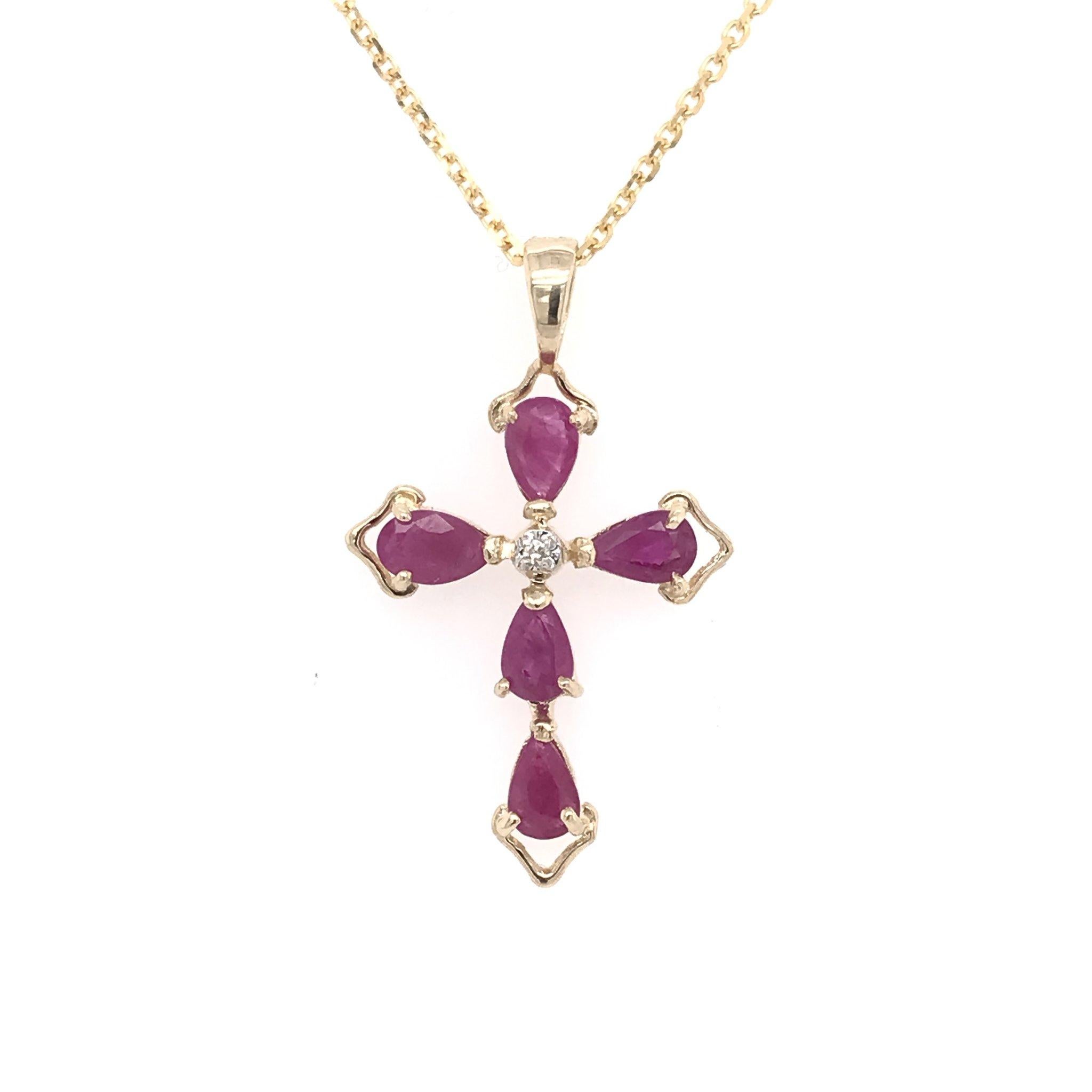 This ruby cross necklace is an estate piece. The pendant is 14k gold and features 5 pear cut rubies as well as one tiny diamond accent in the center. The cross pendant measures approximately 1 inch in length and 1/2 inch in width. The chain is 14k