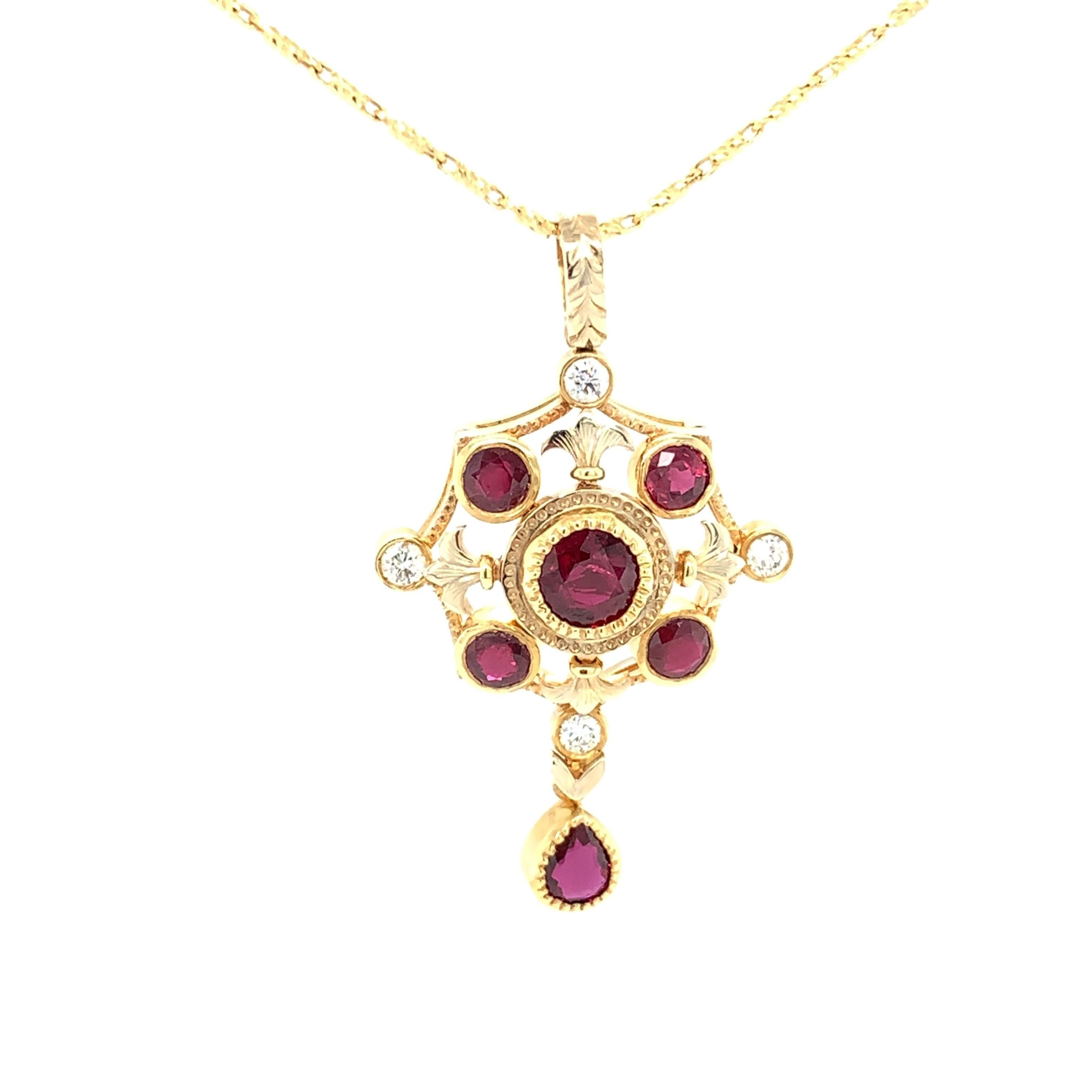 This beautiful pendant features gorgeous red rubies and sparkling white diamonds, set in an original, elegant design. Handcrafted in 18k yellow gold by our Master Jewelers in Los Angeles, this piece has a Renaissance style and timeless feel. The