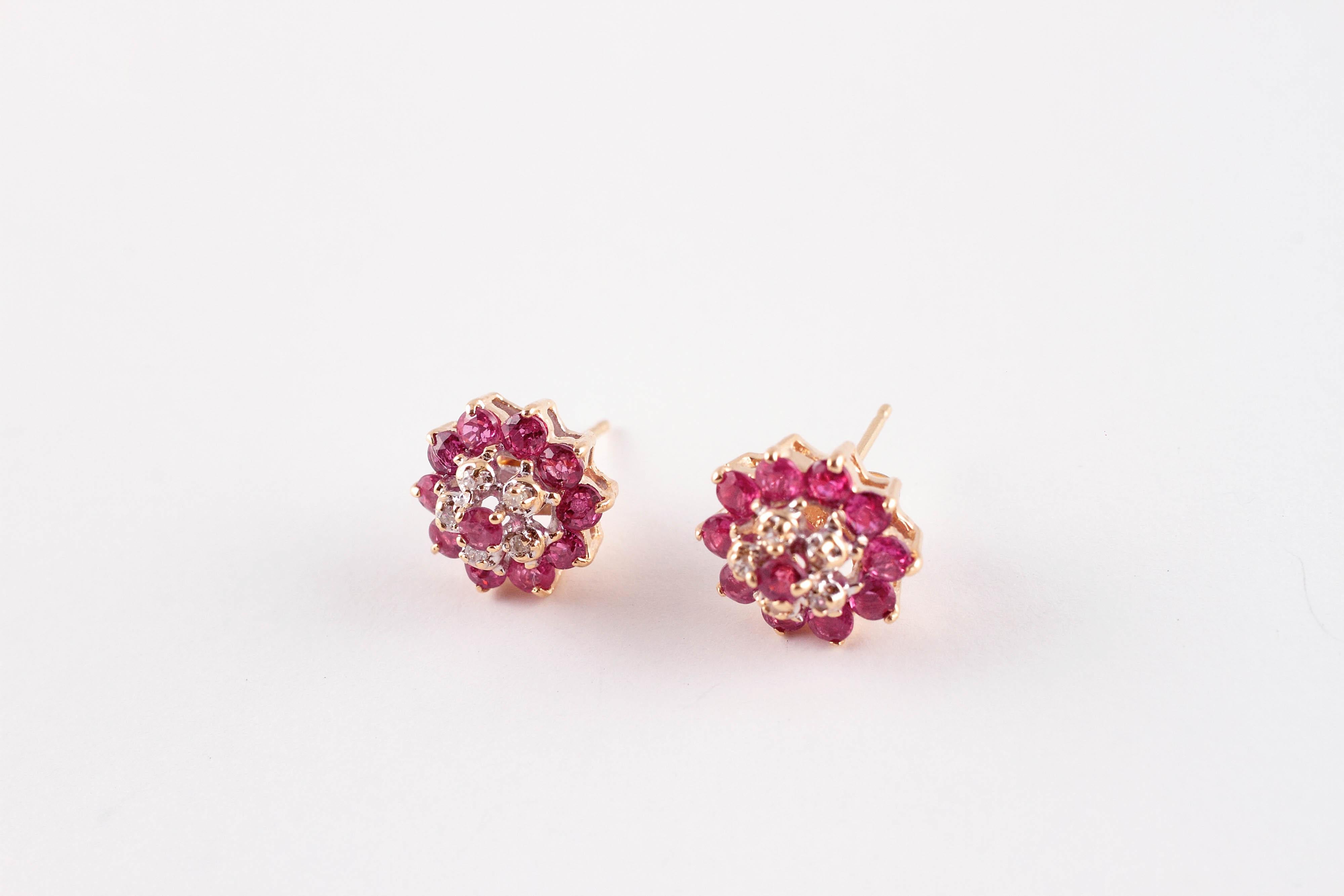 So sweet and comfortable!  In 14 karat yellow gold, these earrings support bright rubies and accent diamonds and are secured with standard friction backs. 