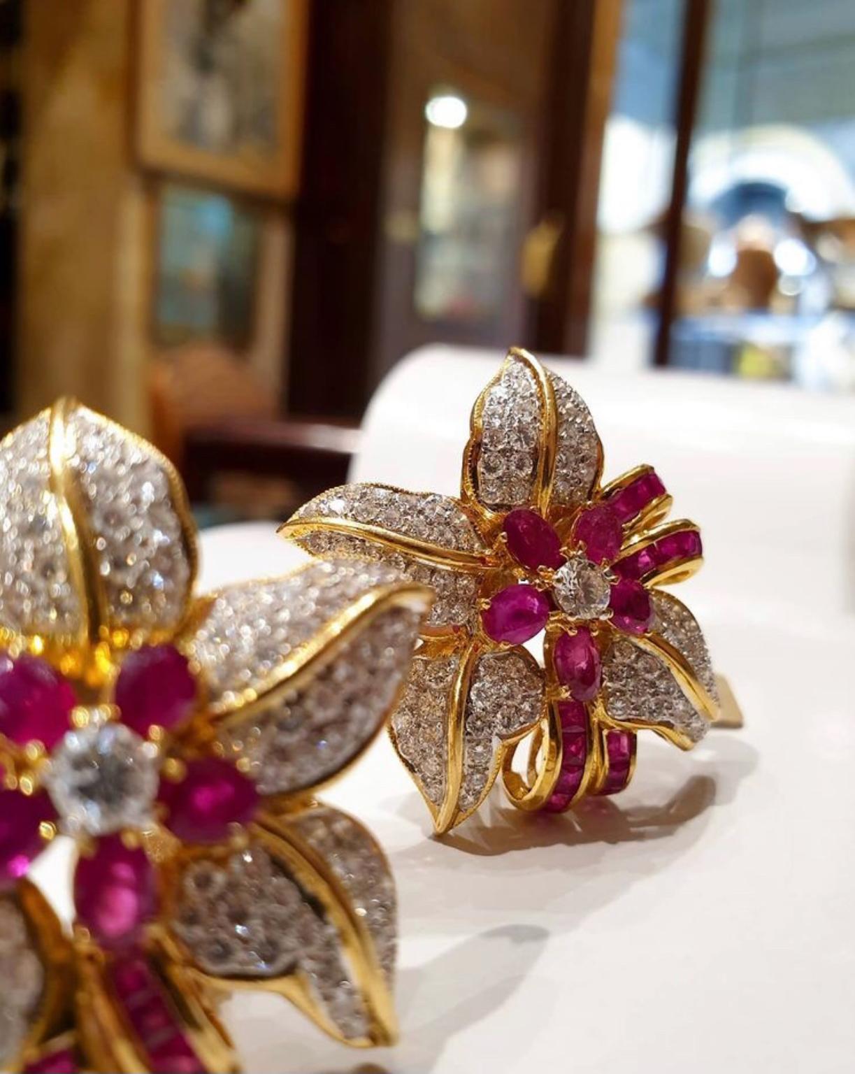 A beautiful pair of ruby and diamond flower earrings in yellow gold.