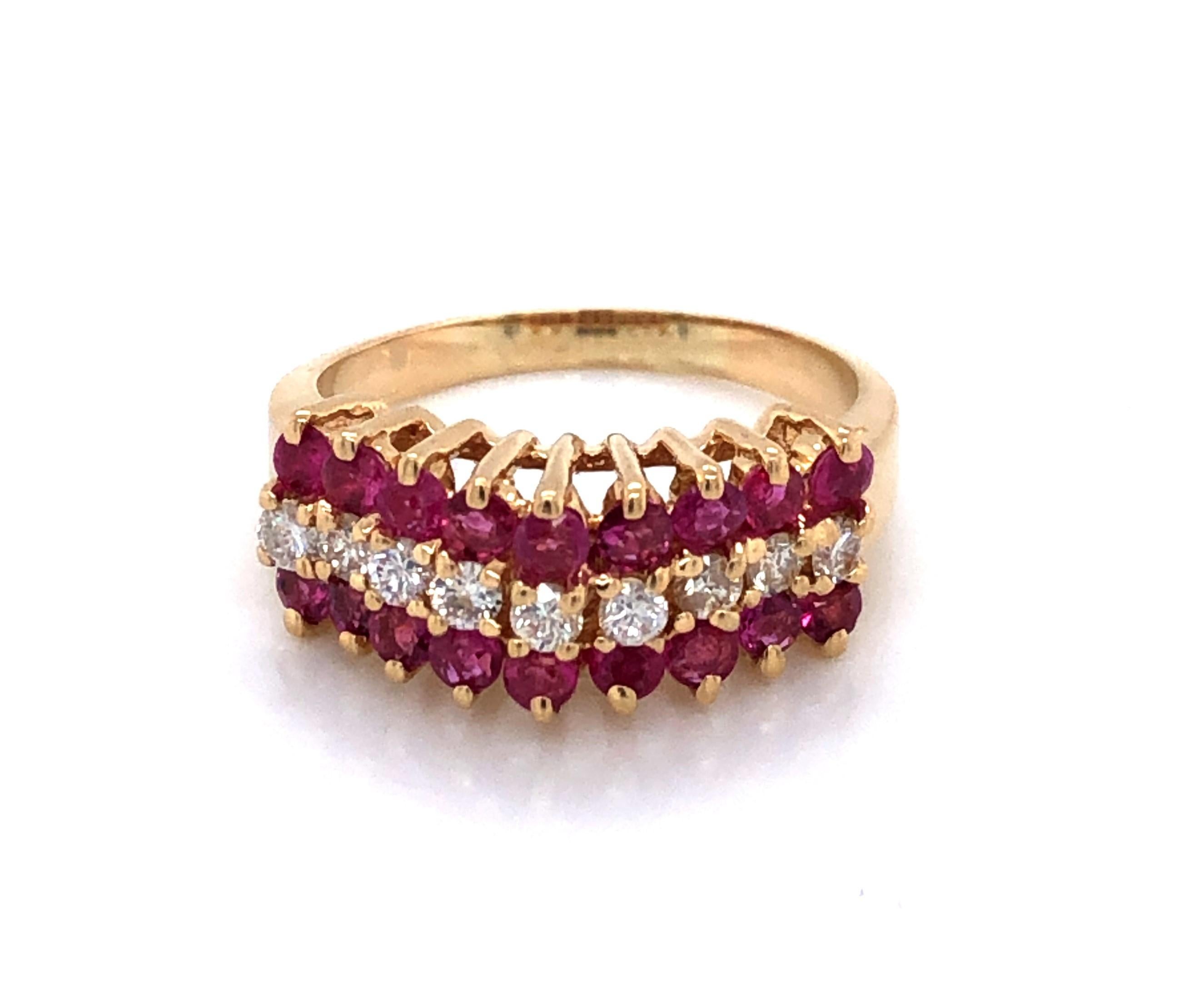 Classic pyramid design and always stunning! A center ribbon of nine .02 carat H/SI  sparkling white diamonds flanked by eighteen colorful .02 carat genuine rubies rise to a pinnacle to create this stunning ring in fourteen karat 14K yellow gold. In