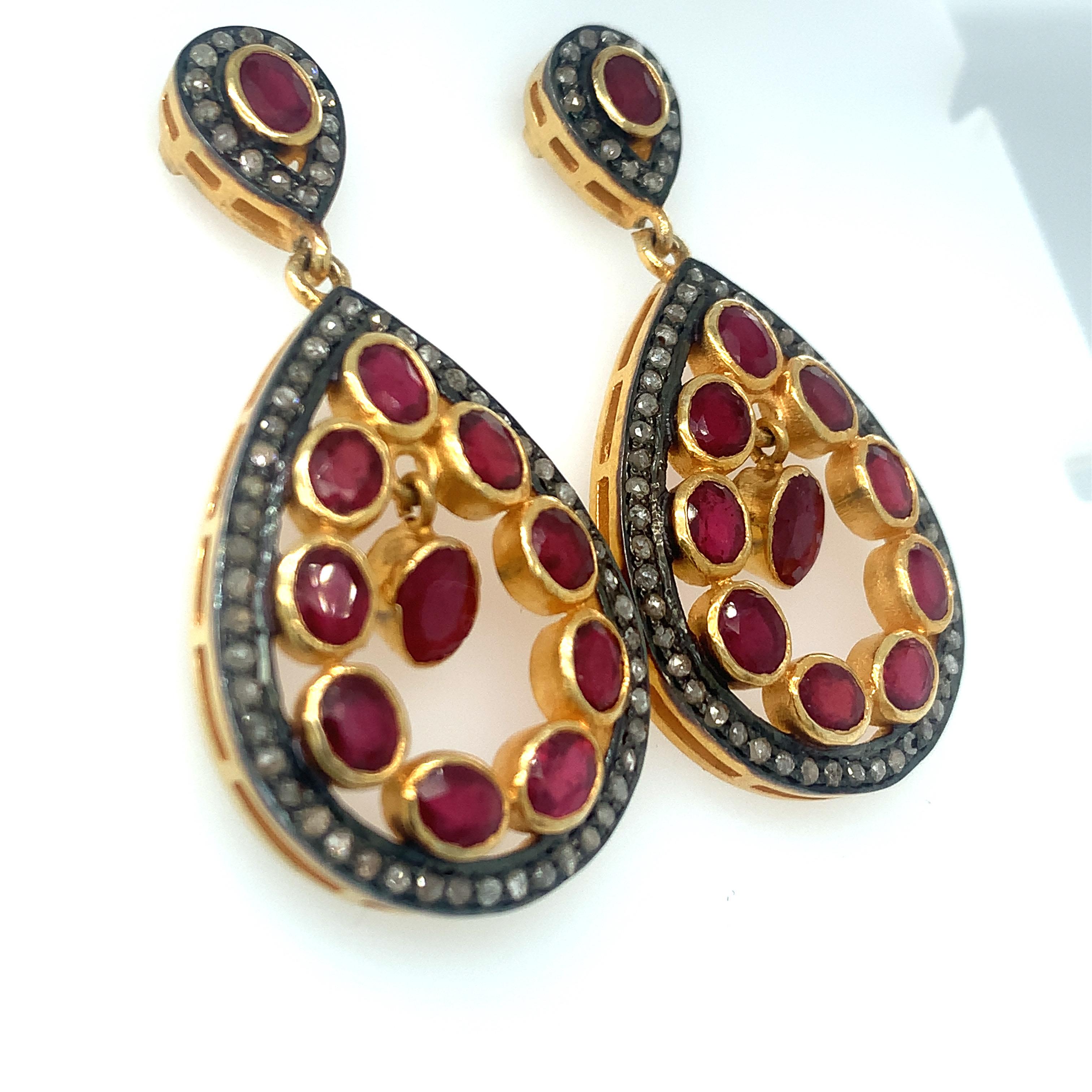 This stunning ruby diamond chandelier earrings comprises 22 pieces of oval rubies with accents of diamonds. It has yellow gold vermeil over sterling silver with post back closure.
Hand cut and polished rubies and crafted by skilled craftsmen.
