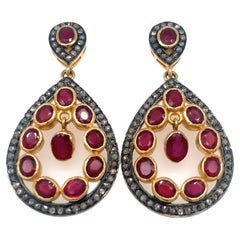 Boucles d'oreilles chandelier en or jaune avec diamant et rubis