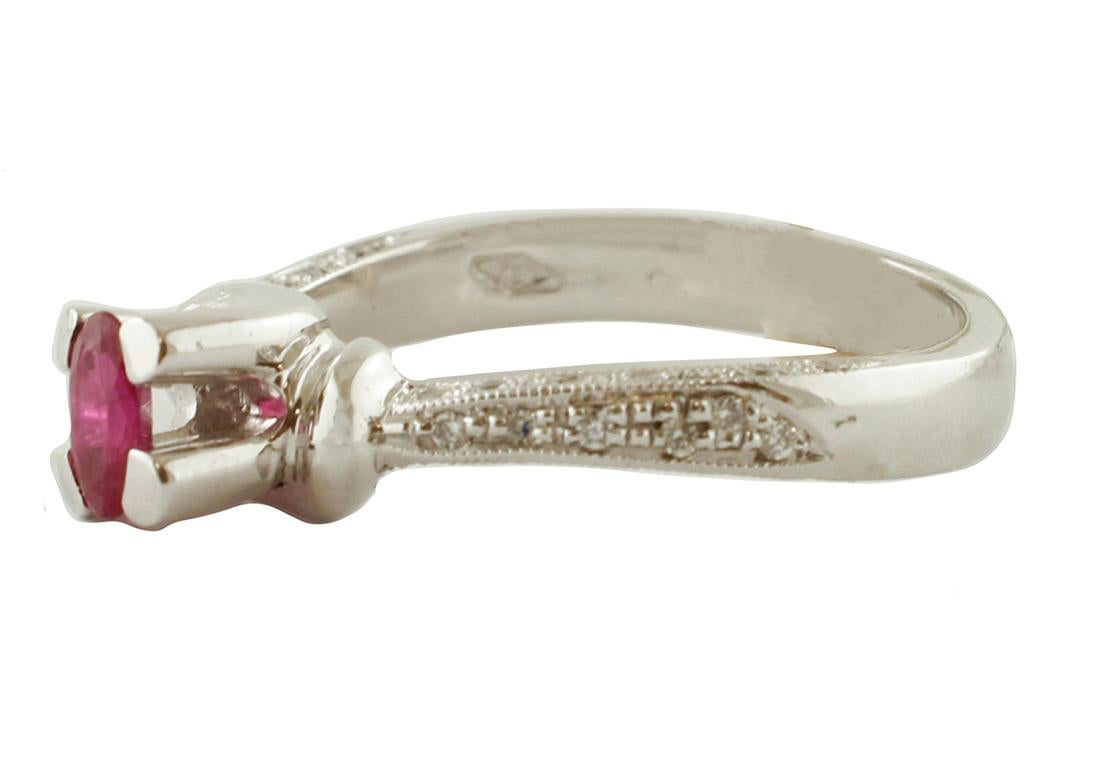 Gorgeous engagement ring in 18 kt white gold structure mounter, in the center, with an oval ruby surrounded by little diamonds.
This ring is totally handmade by Italian master goldsmiths.
Diamonds 0.18 ct, brilliant cut, G Color, VS Clarity
Ruby