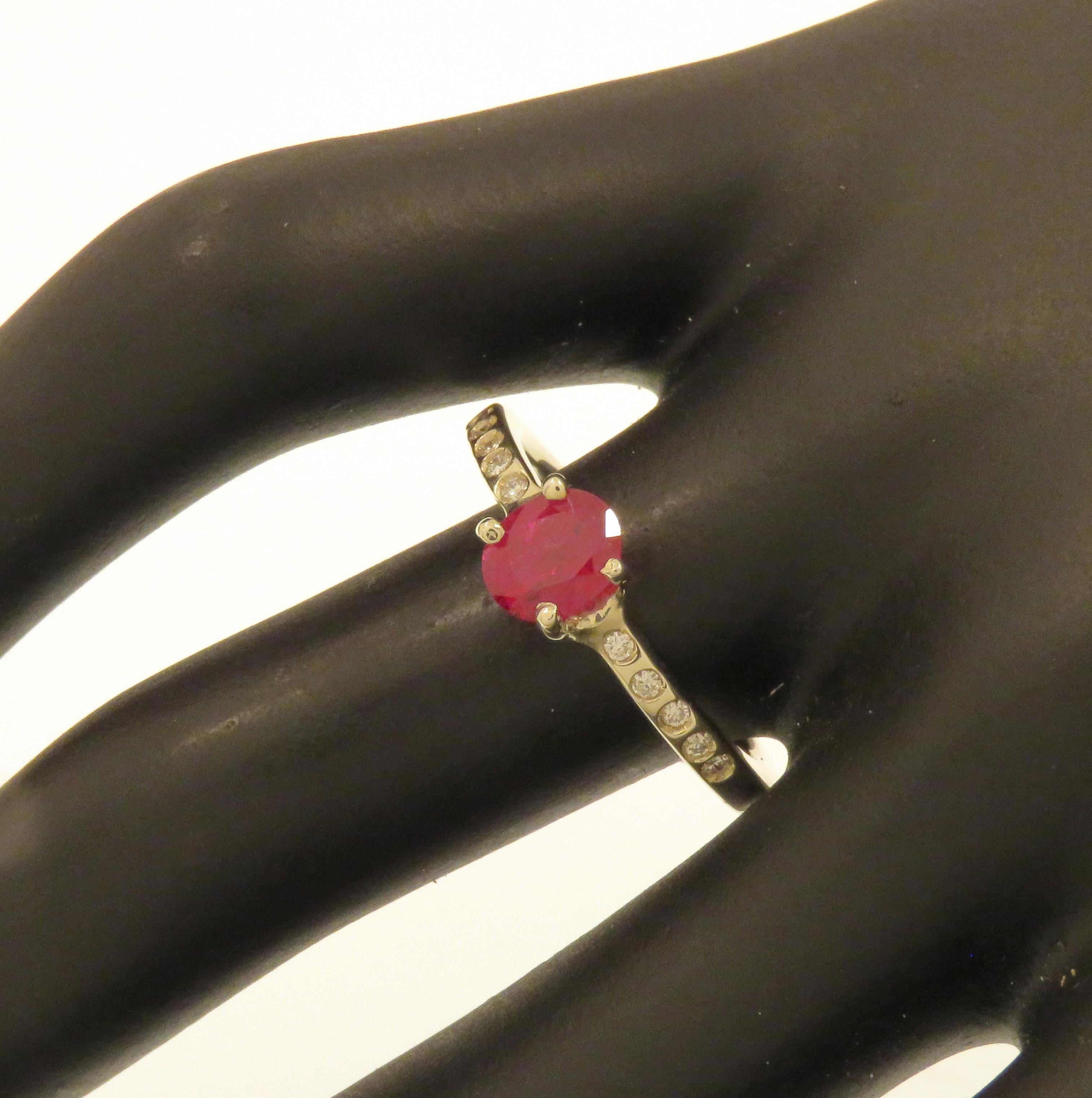 Stunning solitaire ring featuring a natural ruby oval cut and 10 diamonds on the ring shoulders. Handmade in 9k white gold. Marked with the Italian gold mark 375 and Botta Gioielli brandmark 716MI.

Handcrafted in: 9k white gold.
1 natural oval cut