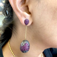 Orecchini pendenti a sfera con rubini e diamanti in oro 18k e argento