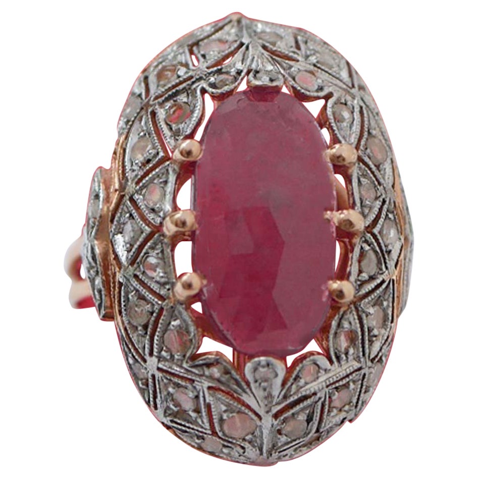 Anello con rubino, diamanti, oro rosa e argento.