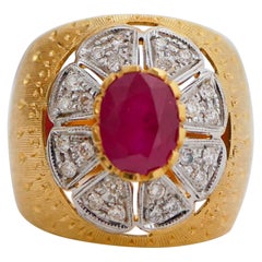 Ring mit Rubinen, Diamanten, Gelbgold und Weißgold.