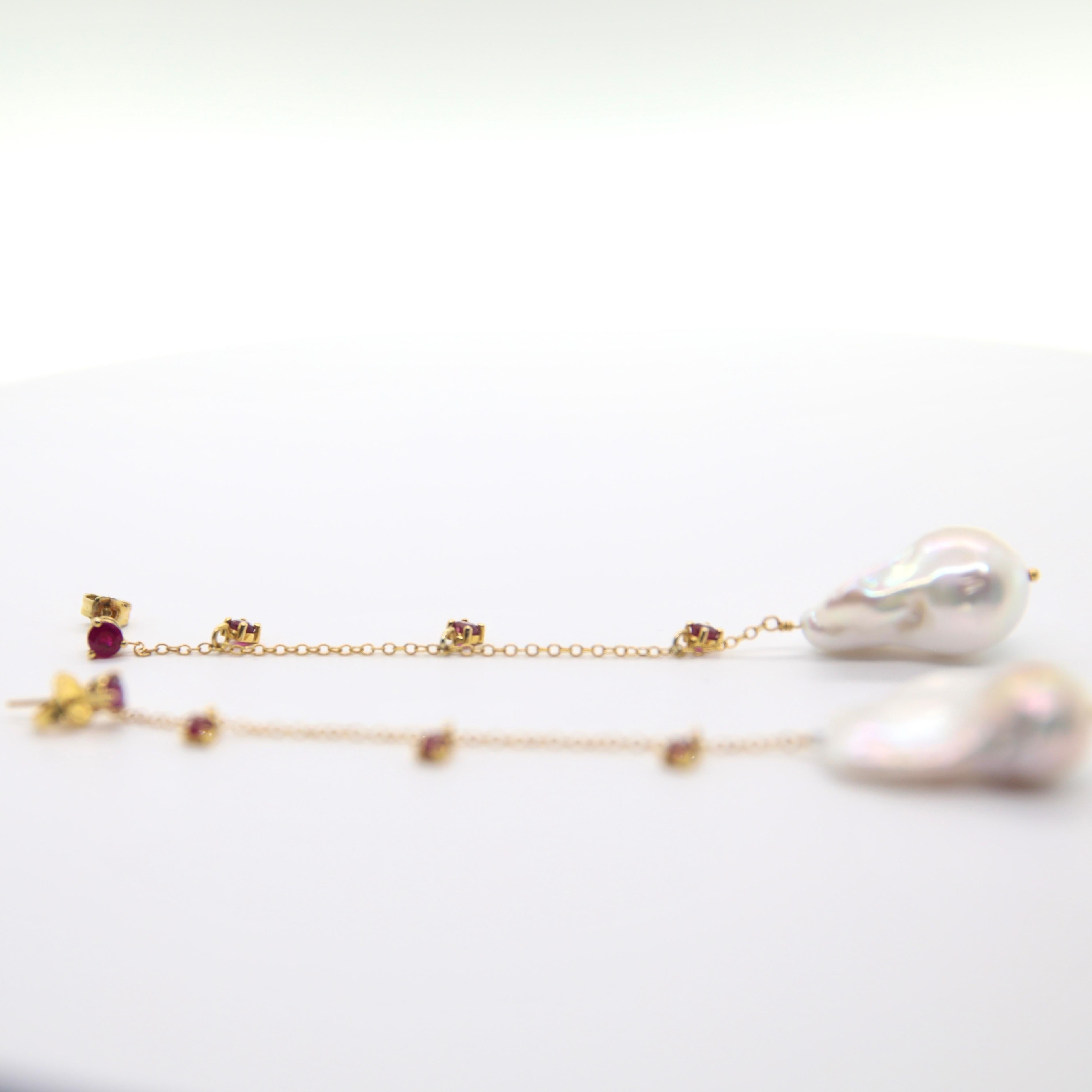 Ruby stud earring- in 14k yellow gold prong is connected with a 14k yellow gold cable chain.

The chain has 3 round rubies on each side, set in a 14k yellow gold prong setting.

*Fit for special occasions and is lightweight/easy for every day