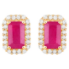 Boucles d
oreilles rubis Halo diamant 0.74 carats Or jaune 14K