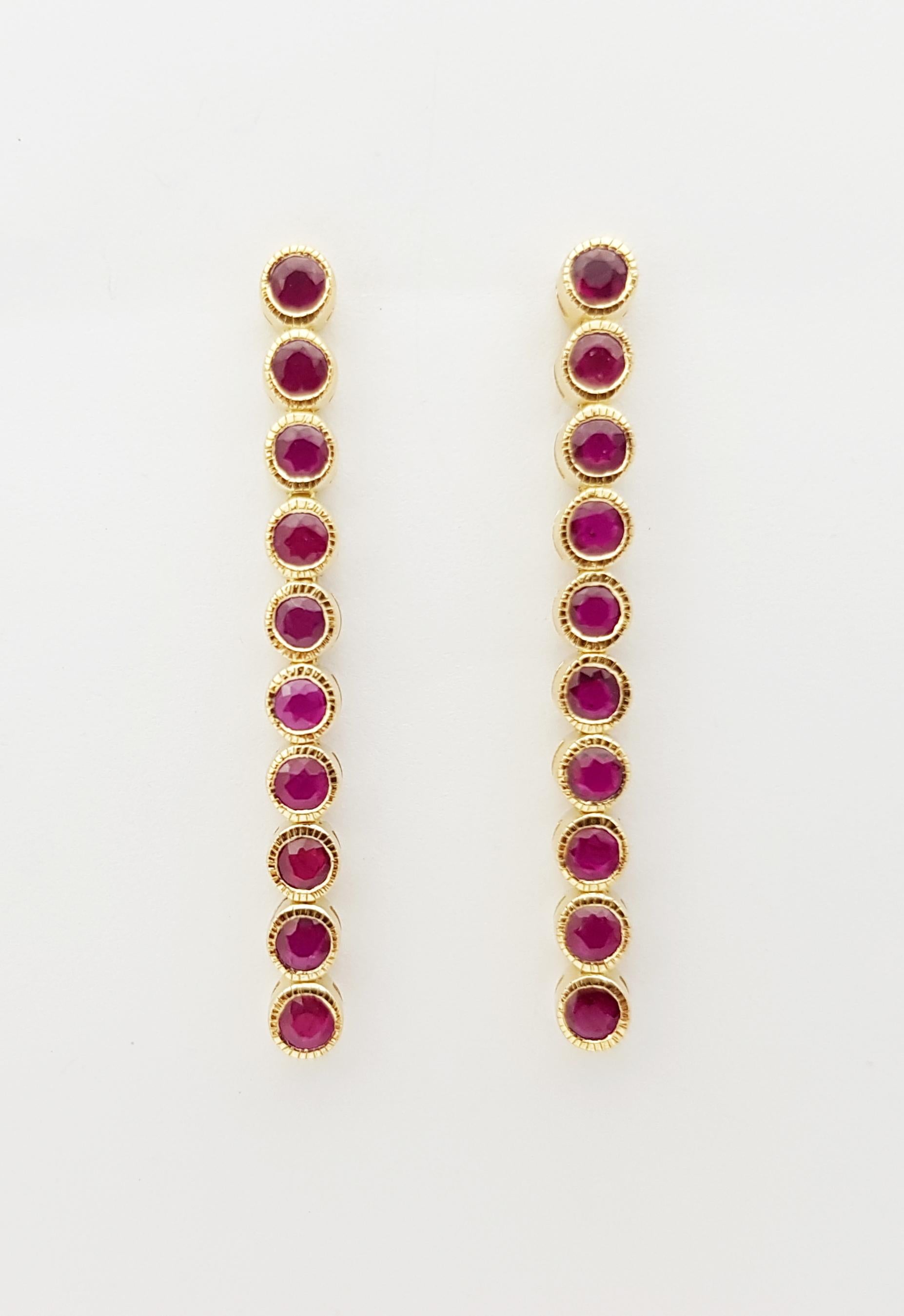 Ruby 1.96  carats Earrings set in 18 Karat Gold Settings

Width:   0.30 cm 
Length:  6.50 cm
Total Weight: 5.99 grams

