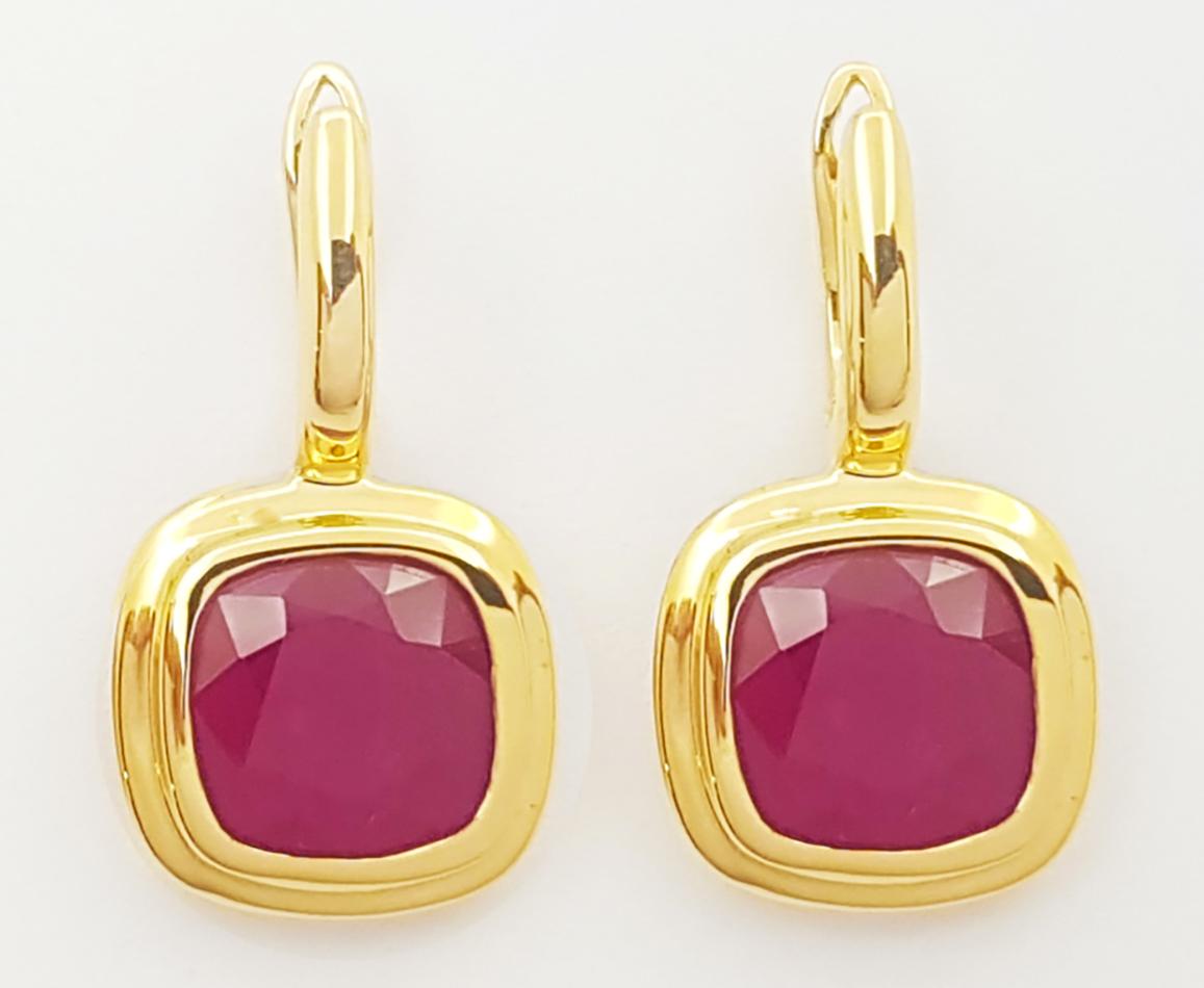 Contemporary Ruby Earrings set in 18K Gold Settings For Sale