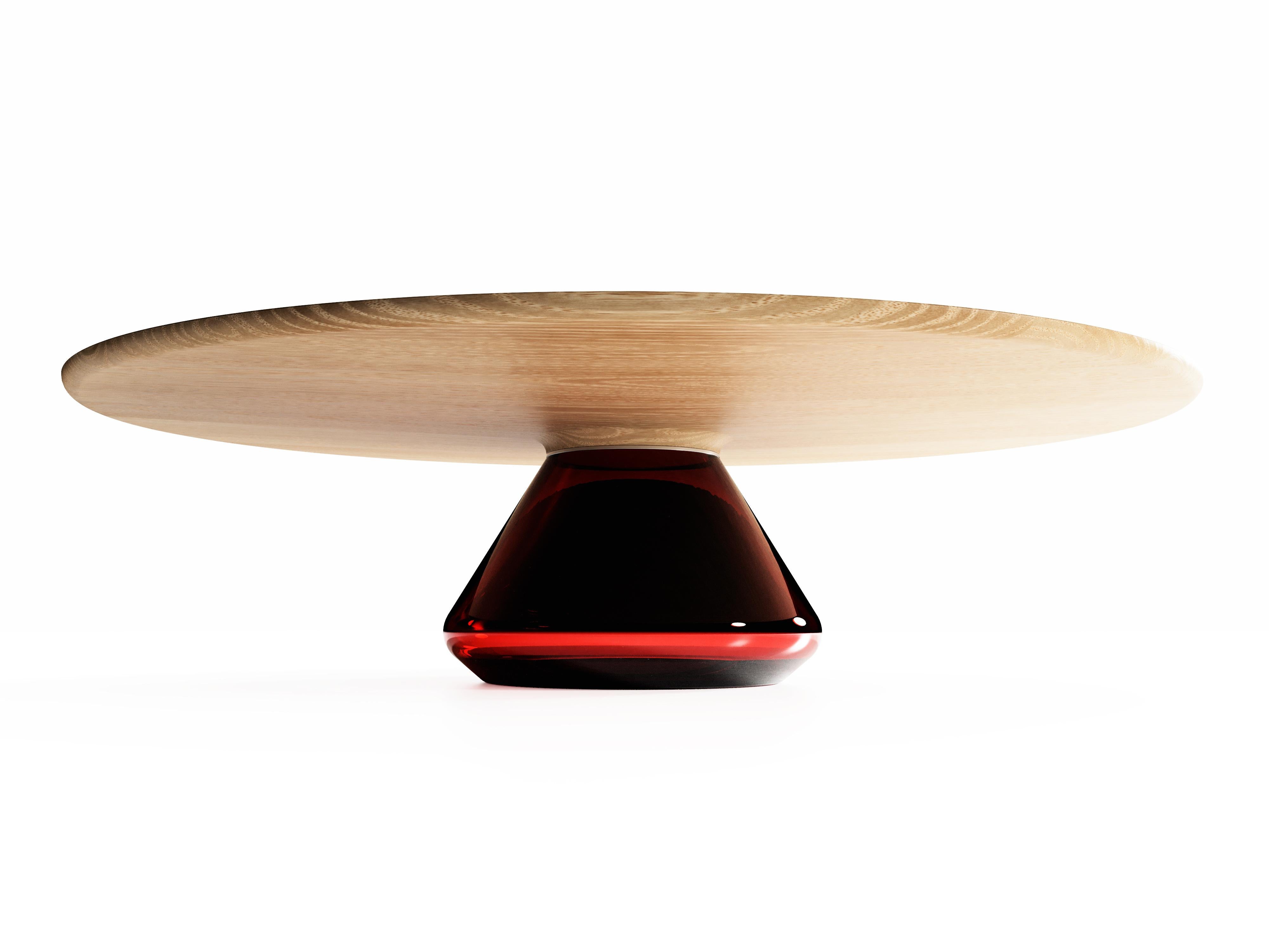 The Ruby Eclipse I, limited edition coffee table by Grzegorz Majka
Limited Edition of 8
Dimensions: 54 x 48 x 14 in
Materials: Glass, oak

The total eclipse of every interior? With this amazing table everything is possible as with its