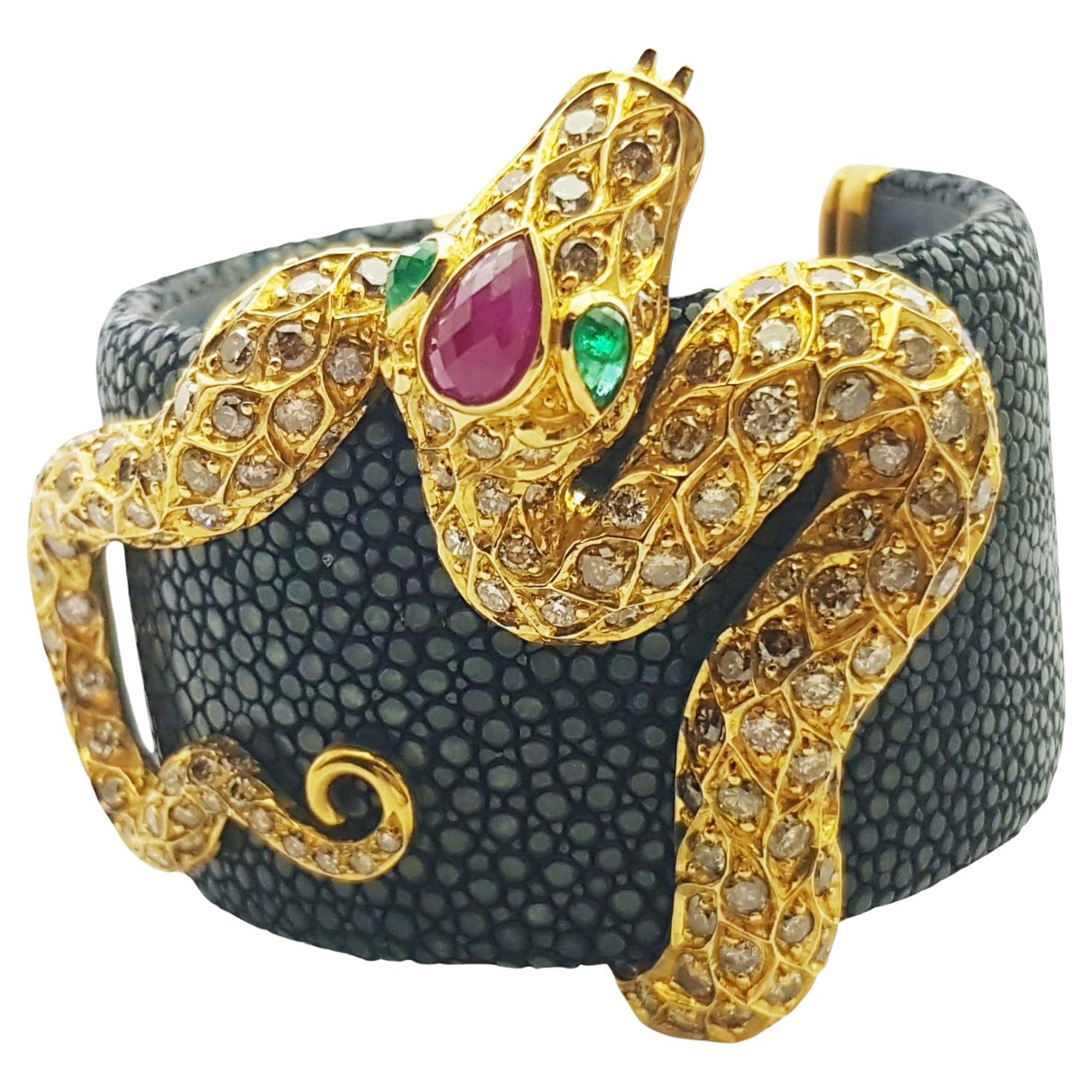 Cabochon Ruby 1.79 carats, Cabochon Emerald 0.58 carat and Brown Diamond 13.99 carats Bangle set in Stingray and 18K Gold Settings

Width: 6.0 cm 
Diameter: 5.5 cm
Total Weight: 79.83 grams

