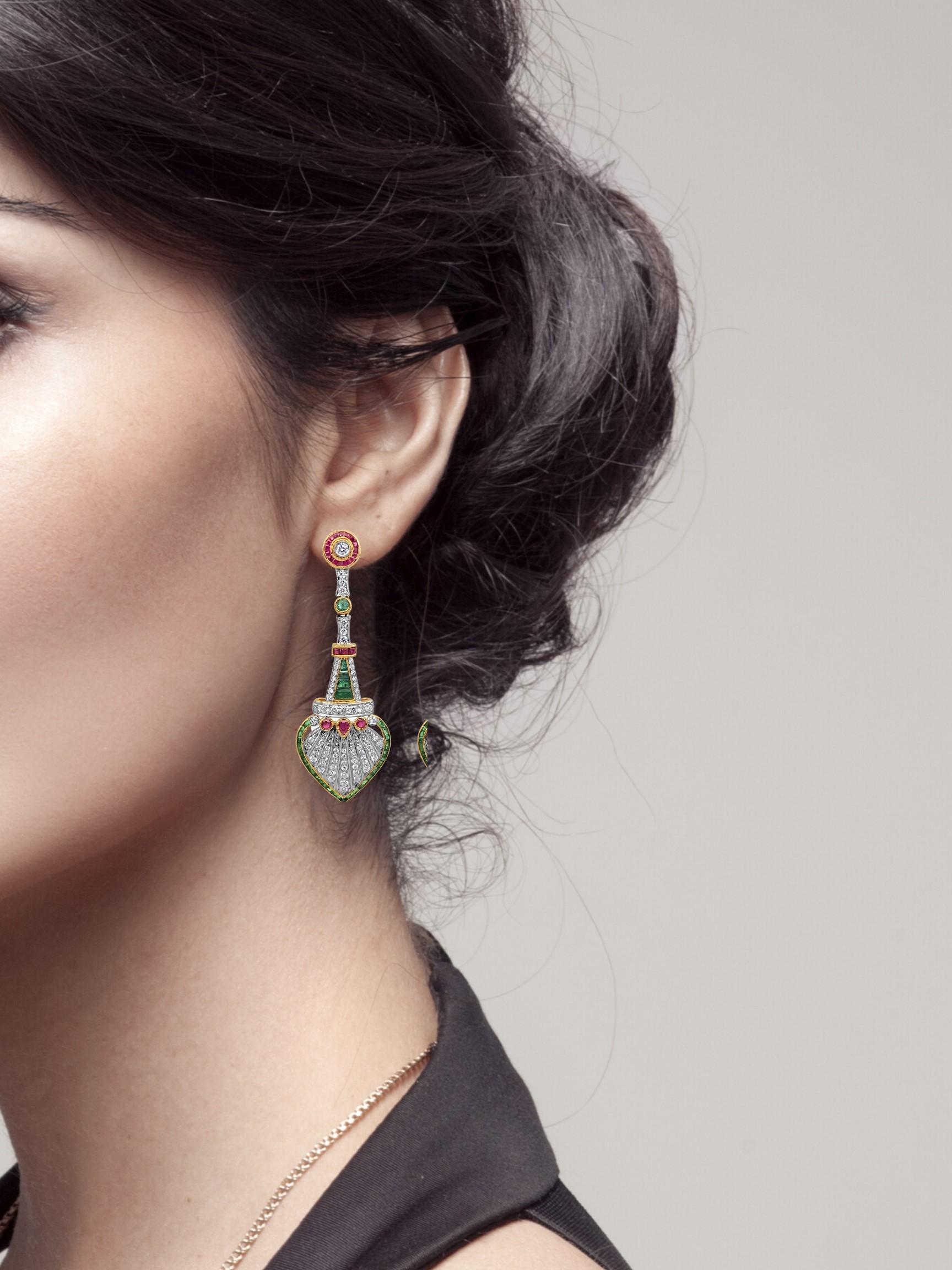 The Morni Nritya draw its inspiration of a dancing peacock. A true-mix of traditional Indian designs and European art decor, these earring feature rubies, diamonds and emeralds, set in 18K white gold.

