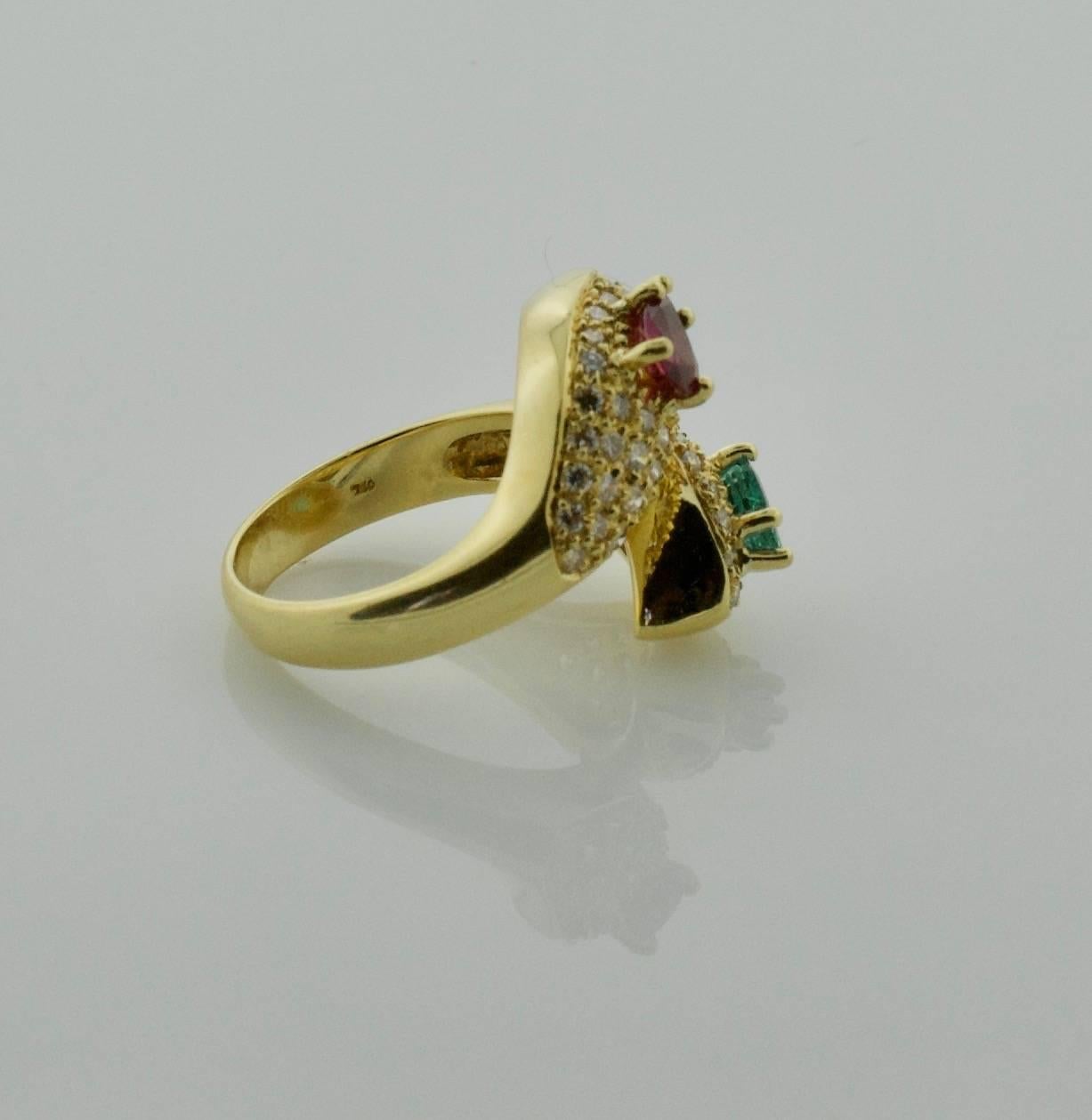 Pear Cut Ruby, Emerald and Diamond Crossover Ring in 18 Karat Yellow Gold