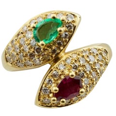 Ruby, Emerald and Diamond Crossover Ring in 18 Karat Yellow Gold