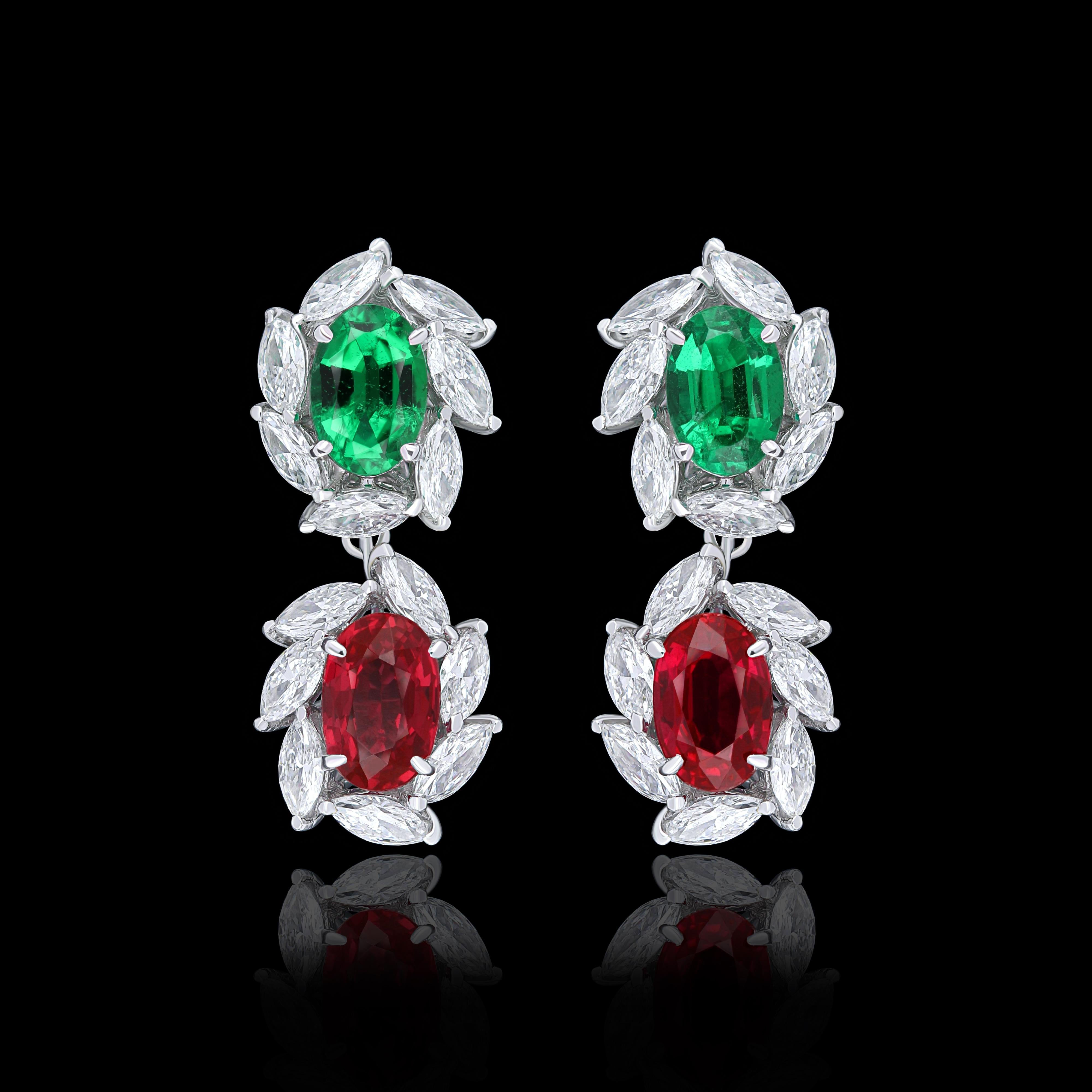 Elegant and exquisitely detailed 18 Karat White Gold Earring, center set with 1.29Cts .Oval Shape Blood Red Ruby, and 0.83Cts Vibrant Emeralds  accented with  micro pave set Diamonds, weighing approx. 1.50Cts Beautifully Hand crafted in 18 Karat