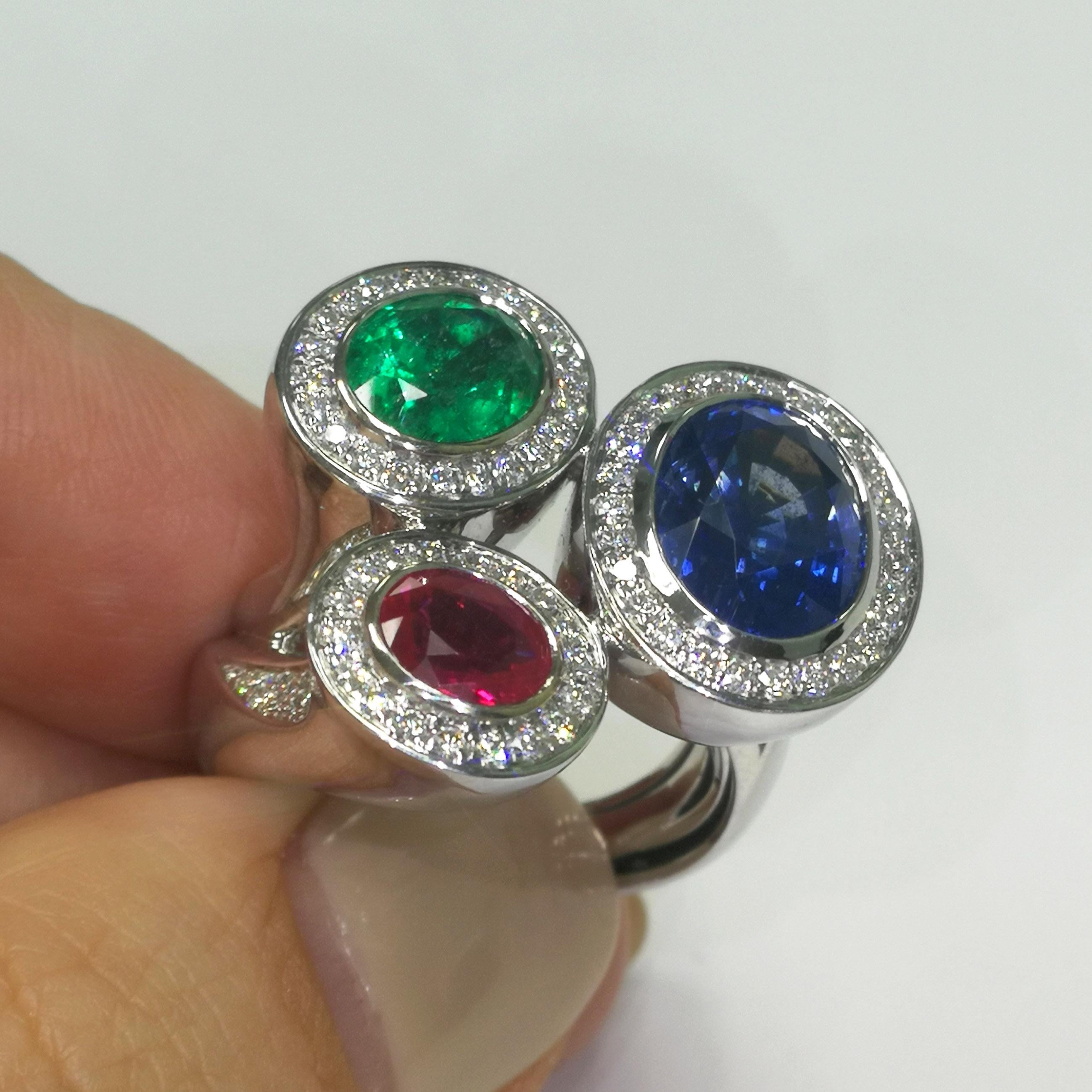 Oval Cut Ruby Emerald Blue Sapphire Diamonds 18 Karat White Gold Trio Ring For Sale