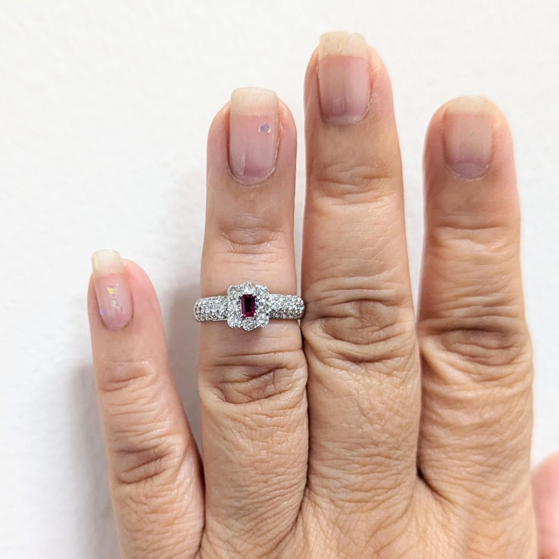 Beautiful 0.18 ct. red ruby emerald cut with 0.86 ct. good quality white diamond rounds.  Handmade in platinum.  Ring size 6.75.