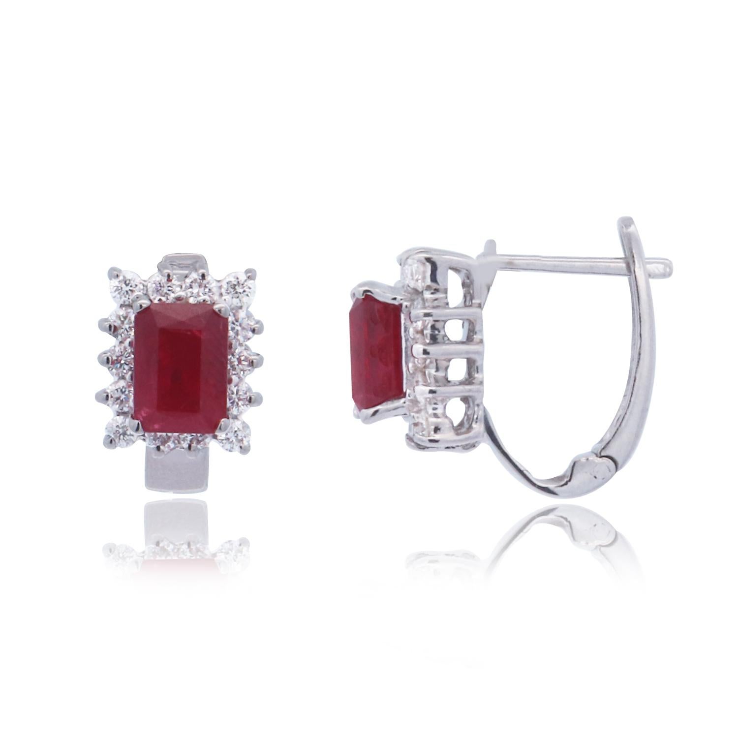 Metal: 18K White Gold
Stone: 2 Ruby Emeralds at 2.57 Carats Total Weight
Accent Stone: 28 Round Diamonds at 0.70 Carats Total Weight 
Color- SI/ Clarity: H-I

Fine one-of-a-kind craftsmanship meets incredible quality in this breathtaking piece of