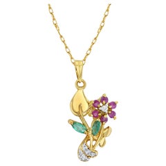 Collar en forma de Flor de Rubí, Esmeralda y Diamantes Oro Amarillo 14k