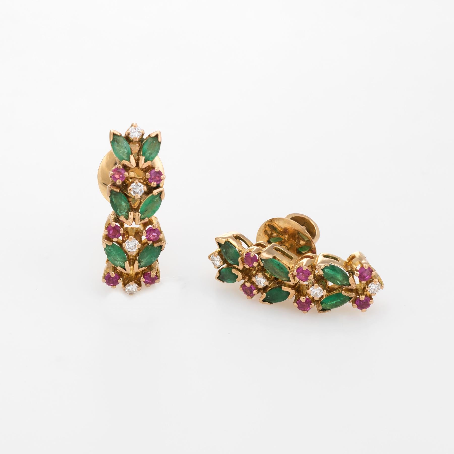 Elegant pair of gemstone shrimp earrings, crafted in 14k yellow gold. 

12 approx. 0.05 carat marquise cut emeralds total an estimated 0.60 carats, accented with 12 approx. 0.01 carat rubies (0.12 carats total estimated weight). The diamonds total