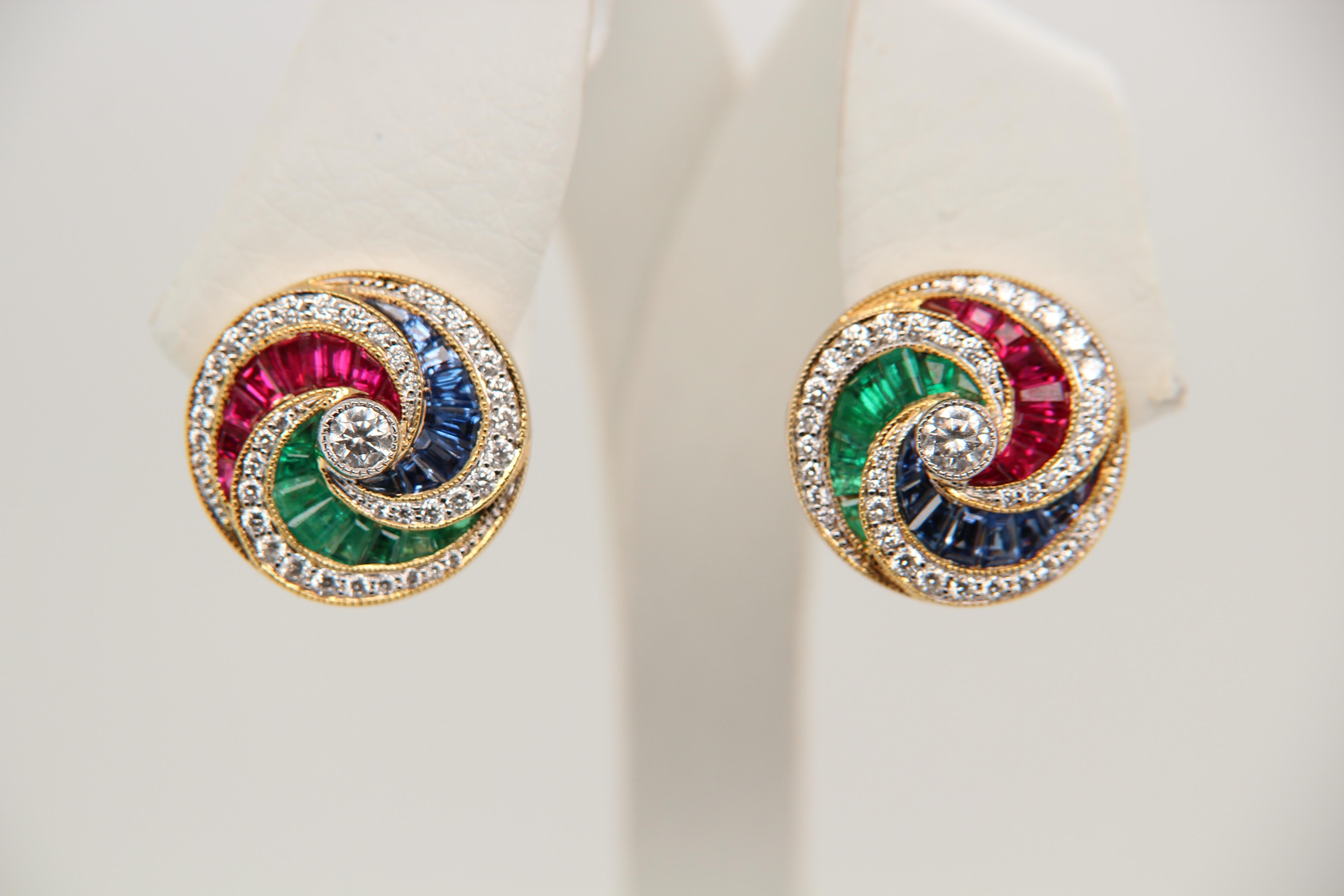 An earring consisting of 1.67 carats of color stone (rubies, emeralds, blue sapphires) and 0.68 carat diamonds. The earring is made of 18k white gold and weighs 5.29 g.