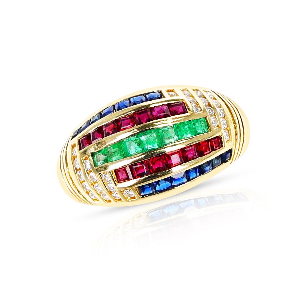 A Ruby, Emerald, Sapphire, and Diamond Cocktail Ring made in 18k Yellow Gold. The ring has a pair of matching earrings that is part of the set. The total weight of the ring is 8.21 grams. The ring size US 6.25. 