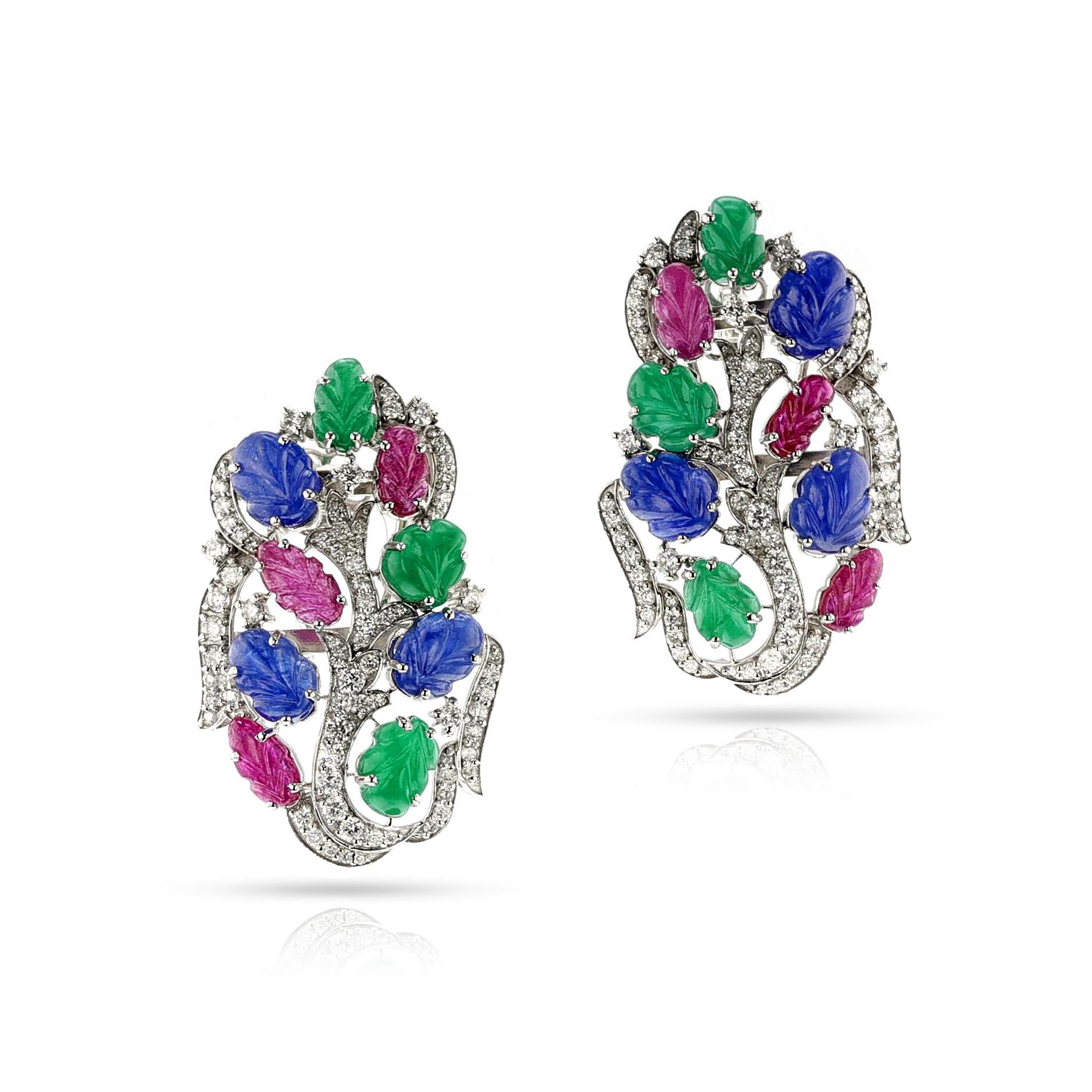 A pair of Ruby, Emerald, Sapphire Carved Leaves with Diamond Earrings, 18k White Gold. The carvings weigh appx. 19 carats and the diamonds weigh appx. 2 carats. The total weight is 19.56 grams. The dimensions are 1.75 inch x 1 inch. A unique and