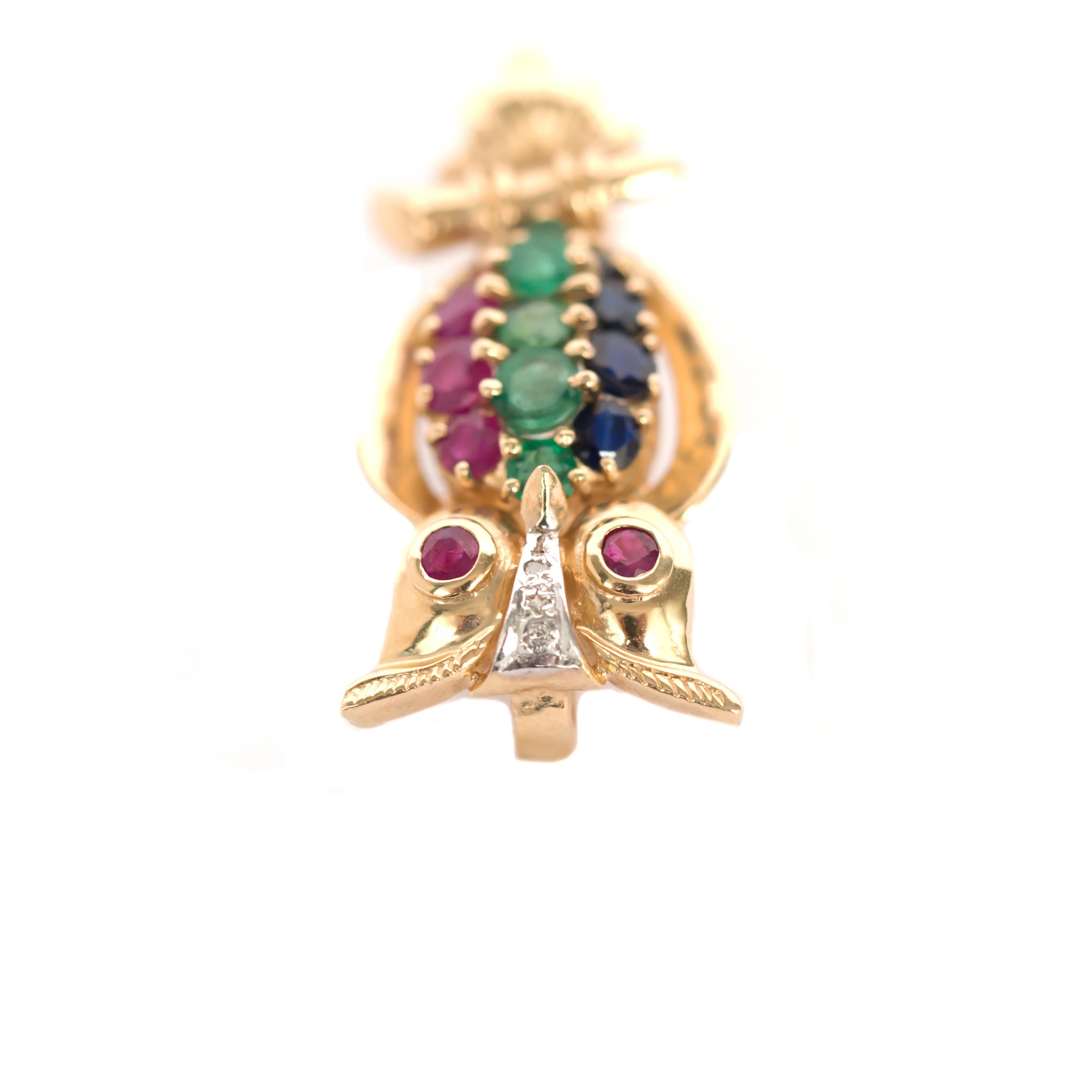 Item Details: 
Length: 1 Inch
Metal Type: 14 karat Yellow Gold
Weight: 4.7 grams

Color Stone Details: 
Type: Ruby, Emerald, Sapphire
Carat Weight: .75 carat, total weight.


Finger to Top of Stone Measurement: 4.34mm