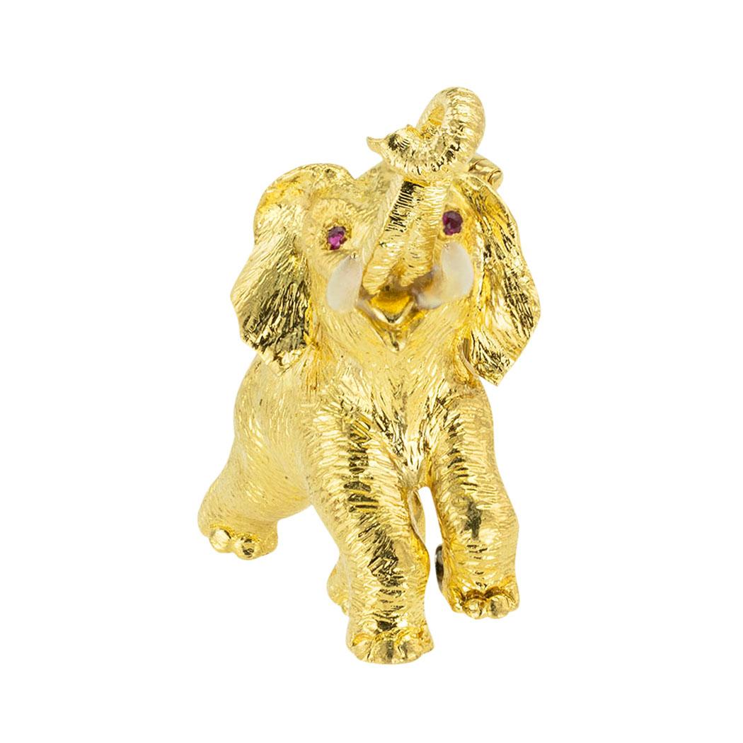 Ruby enamel ruby and yellow gold figural elephant clip brooch circa 1970.  *

ABOUT THIS ITEM:  #P-DJ1130F. Scroll down for specifications.  Looks like a wild elephant, gentle and majestic.  This beautifully animated elephant clip brooch is depicted