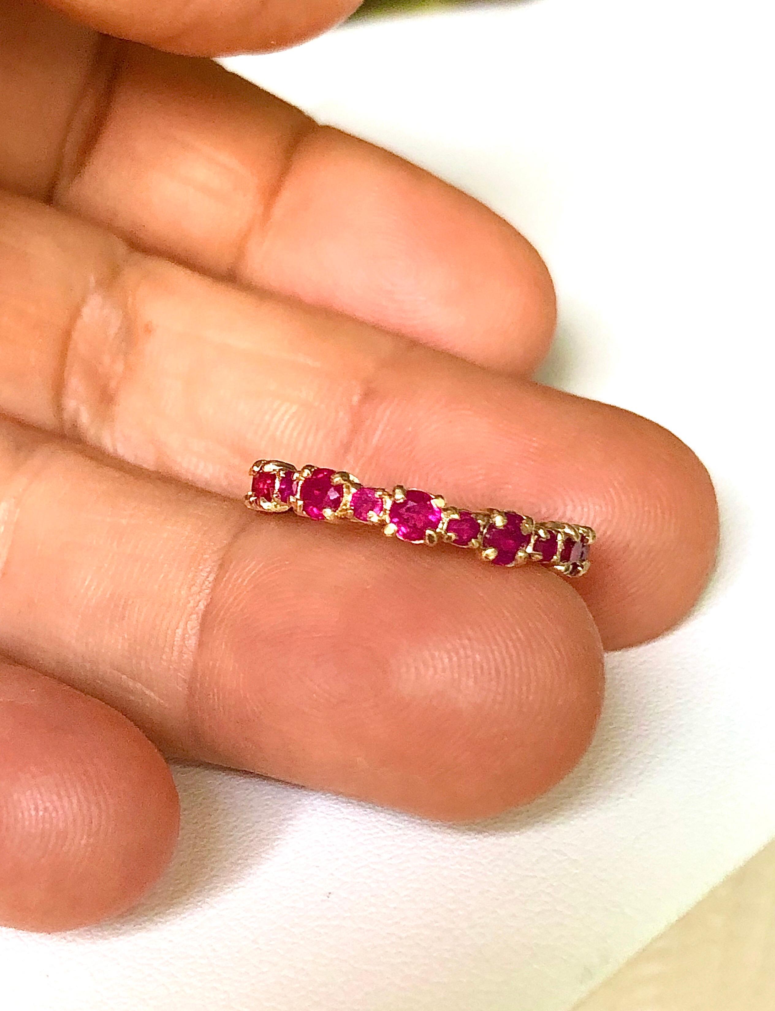 Engagement Eternity Ruby Gold Band Ring Beautifully made ruby eternity band. 26 round cut rubies weigh a total of 2.0 carats. The band is 3.2mm wide. The band is made of 14K yellow gold. US size 7.5
Comments: This ring is sold out. A custom-made