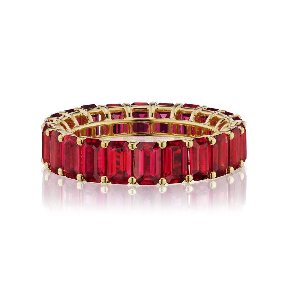 PIGEON BLOOD COLOR RUBY ETERNITY BAND
A timeless eternity Ruby band in 18k Yellow Gold with emerald-cut stones around. This design is one for the classics. ( Ring Size 7 )
Item:	# 03793
Setting:	18K Y
Color Weight:	7.23 ct. of Ruby
