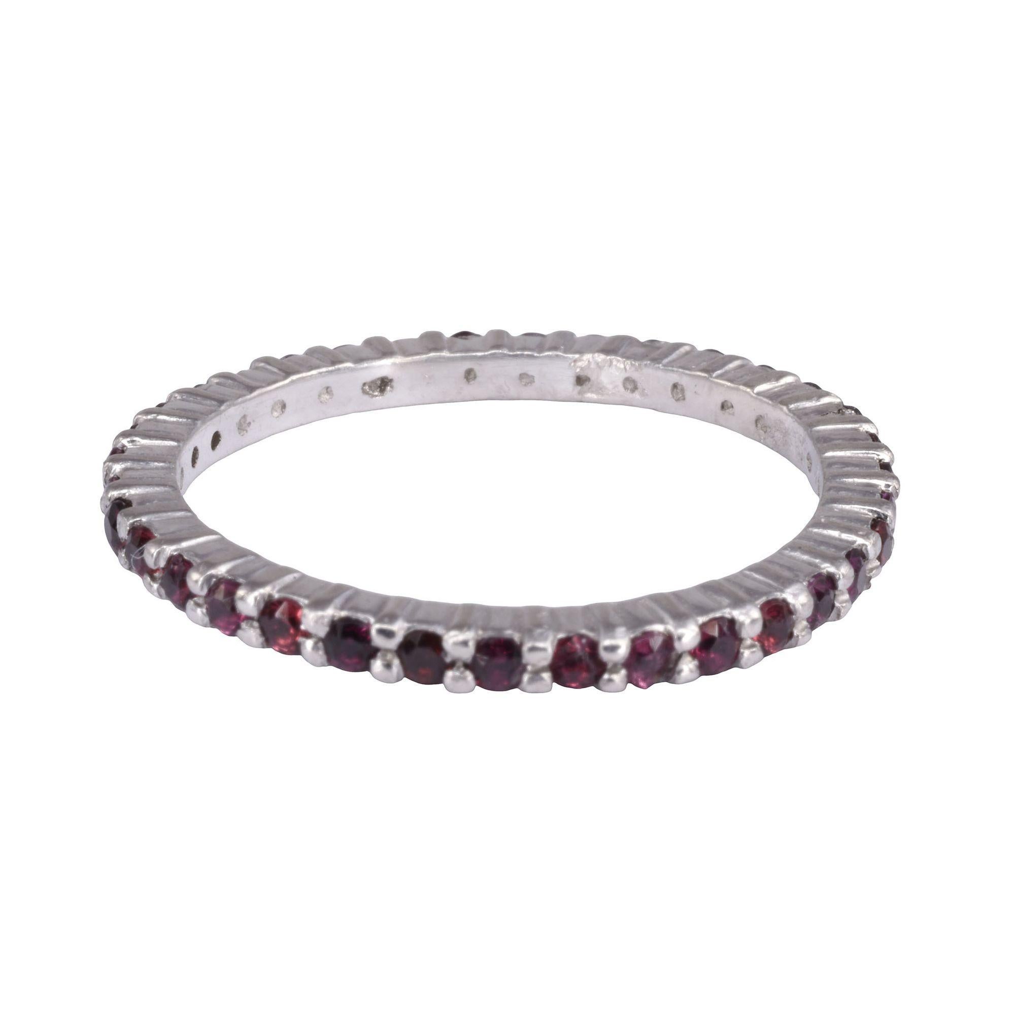 Estate ruby eternity band. This 14 karat white gold eternity band features .50 carat total weight of rubies. The ruby ring is a size 5.5. [KIMH 2106 P]