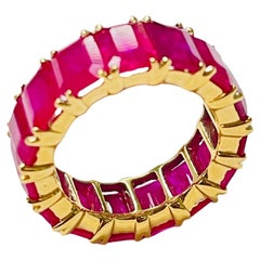 Ruby Eternity Band In 18 Karat Yellow Gold.