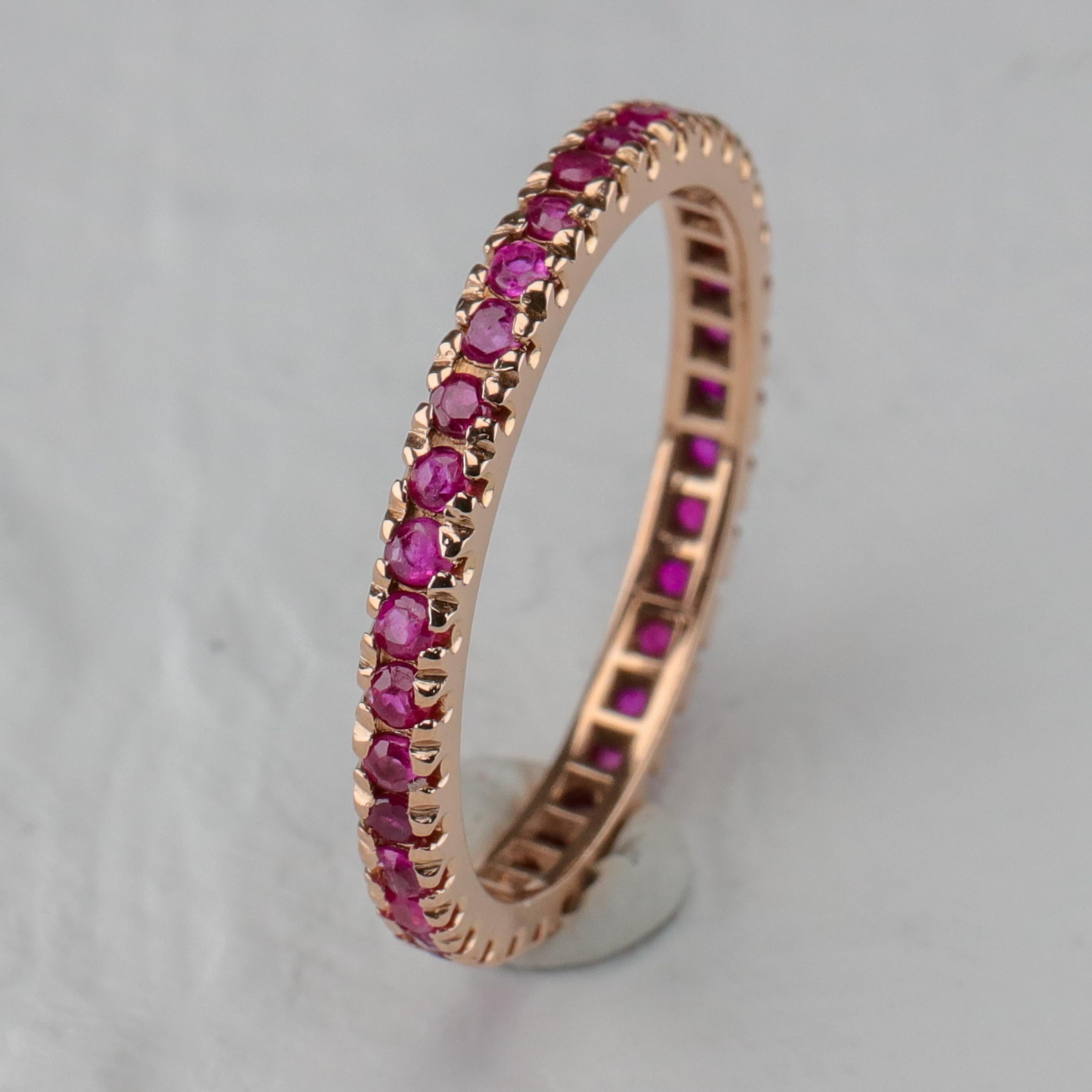 Because I collect rare or one-of-a-kind jewels, this does seem like a rather odd piece for me to be offering. A ruby eternity band? That's not exactly rare. A size ten ruby eternity band? Hello, rare.

This circa 1940s Retro-era ring is composed of