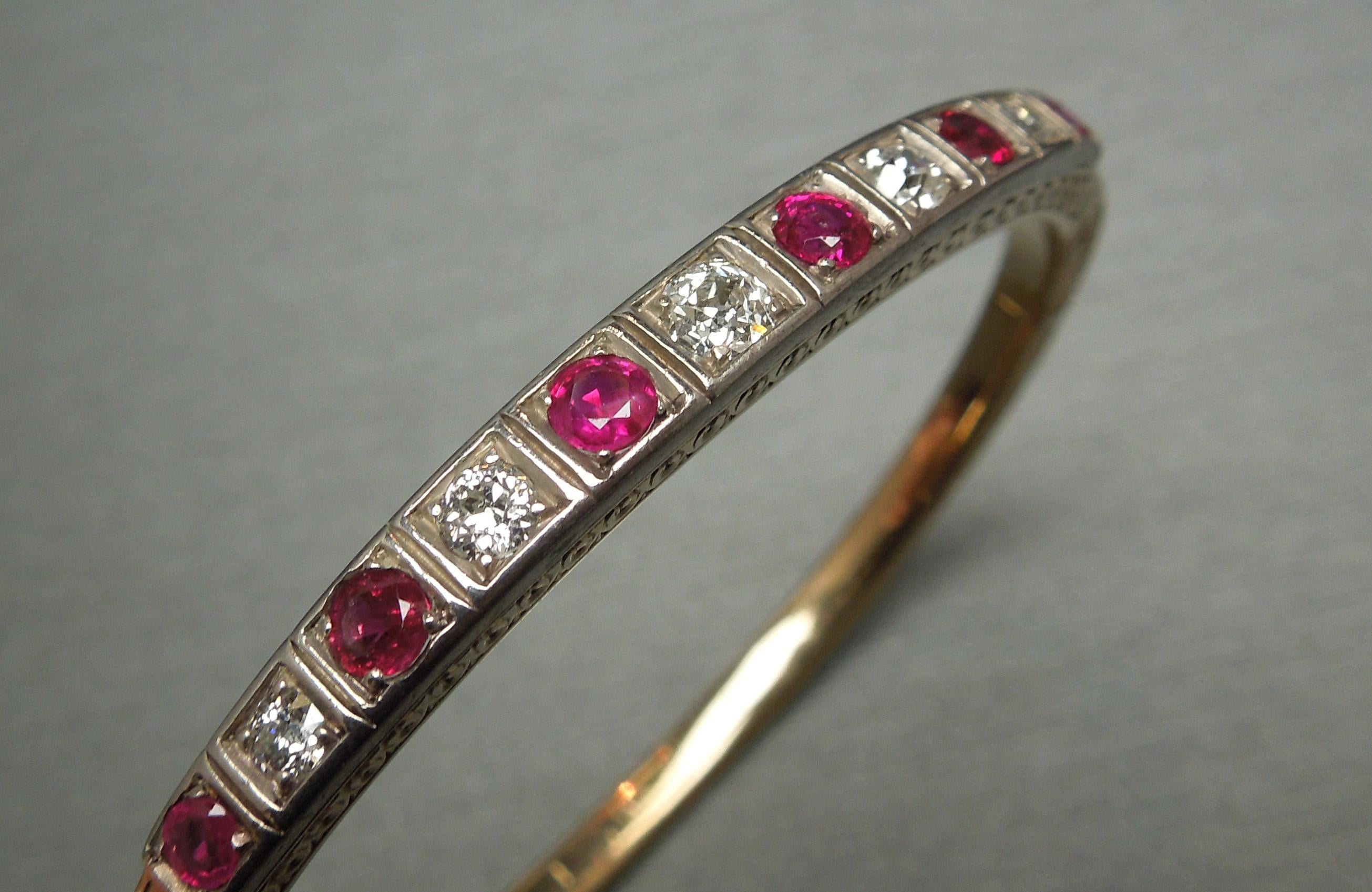 In a combination of 14KT Yellow Gold & Sterling Silver, this Ruby & Diamond bangle features 1.35 carats of Round cut Intense Fine Red Rubies and 1 carat of Nearly Colorless Nearly Flawless Old European cut Diamonds each secured in a Square illusion