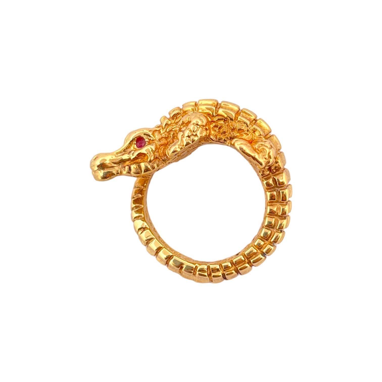 Unleash your wild side with our Ruby Eye Crocodile Ring. Crafted in 14K yellow gold and weighing 3.40 grams, this ring features captivating ruby eyes that give it a bold and exotic flair. Make a statement with this unique and fierce jewelry piece
