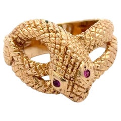 Anillo Envolvente de Serpiente Ojo de Rubí 14 Kilates Oro Amarillo 11.6 Gramos