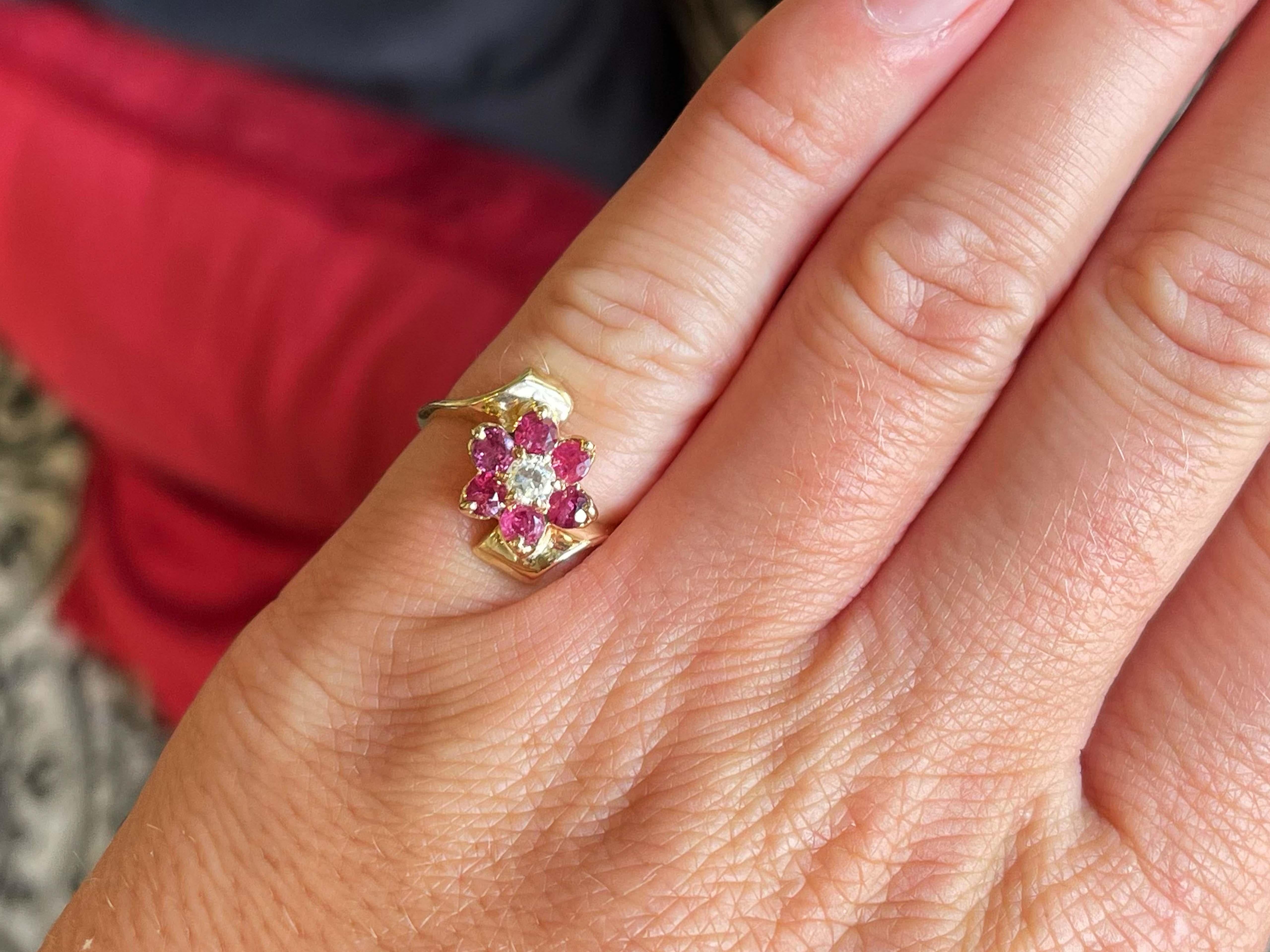 Item Specifications:

Metal: 14K Yellow Gold

Total Weight: 3.7 Grams

Gemstone Specifications:

Gemstones: 6 red rubies

Ruby Carat Weight: ~0.50 carats

Diamond Carat Weight: 0.10 carats

Diamond Count: 1

Diamond Color: I

Diamond Clarity: