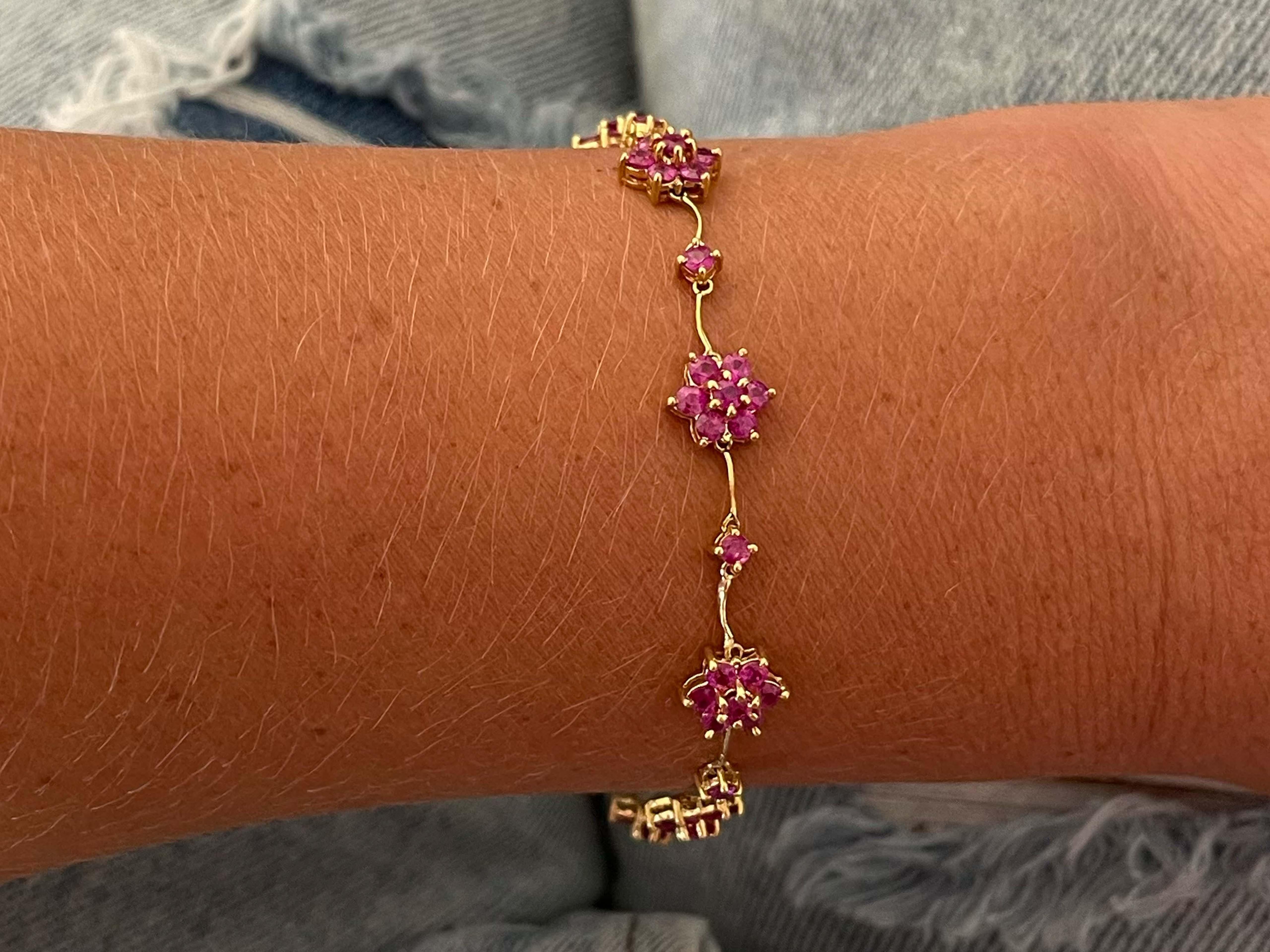 Bracelet Specifications:

Metal: 18k Yellow Gold

Gemstone: 55 red rubies

Ruby Carat Weight:  2.75 carats

Bracelet Length: ~6.5 inches

Bracelet Width: ~ 7.7 mm

Total Weight: 7.4 Grams

Condition: Vintage, Excellent

Stamped: 