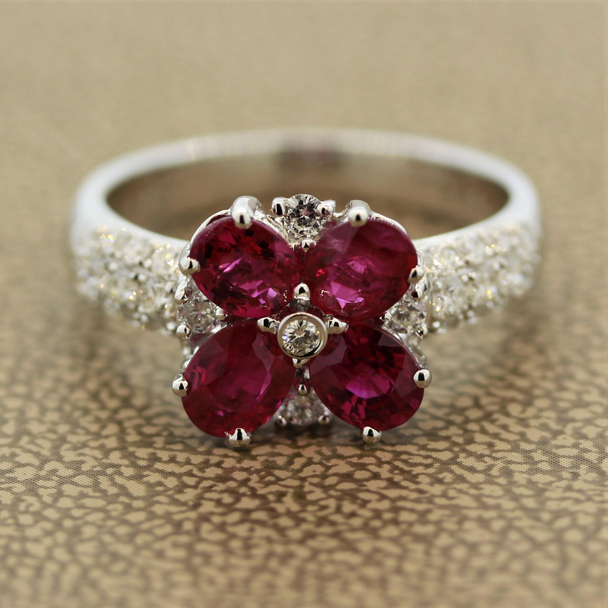 A sweet ring featuring 4 oval shaped rubies weighing a total of 1.77 carats. They have a bright clean red color and are set as the petals of a flower. They are complemented by 0.48 carats of round brilliant cut diamonds made in 18k white gold.

Ring