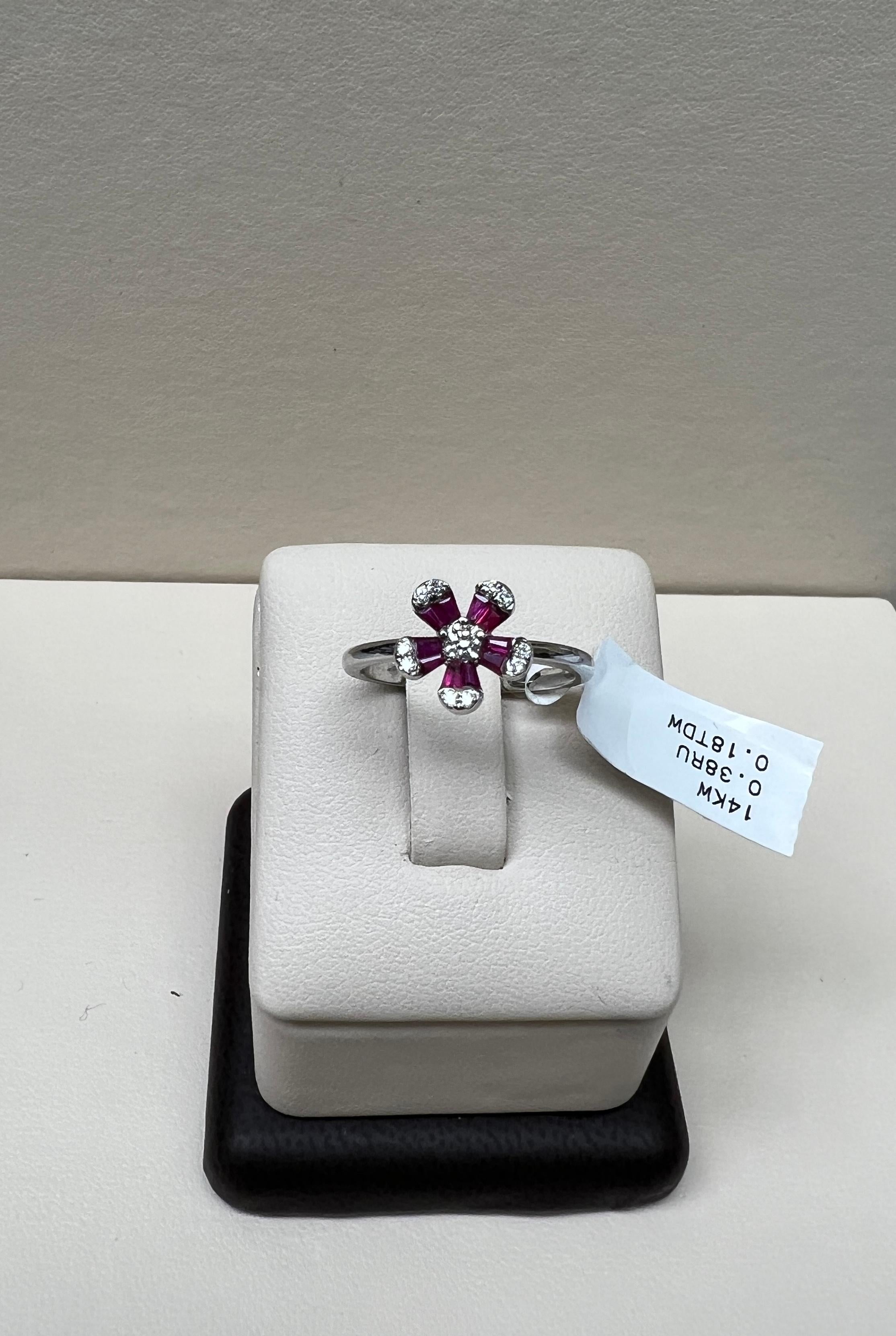 Solid 14K White Gold

Natural Round White Diamonds .18 Total Diamond Weight

G-H Color SI Clarity 

Natural Red Ruby Baguettes .38 Total Carat Weight

Size 6.5 - Sizable 

Free Insured Shipping