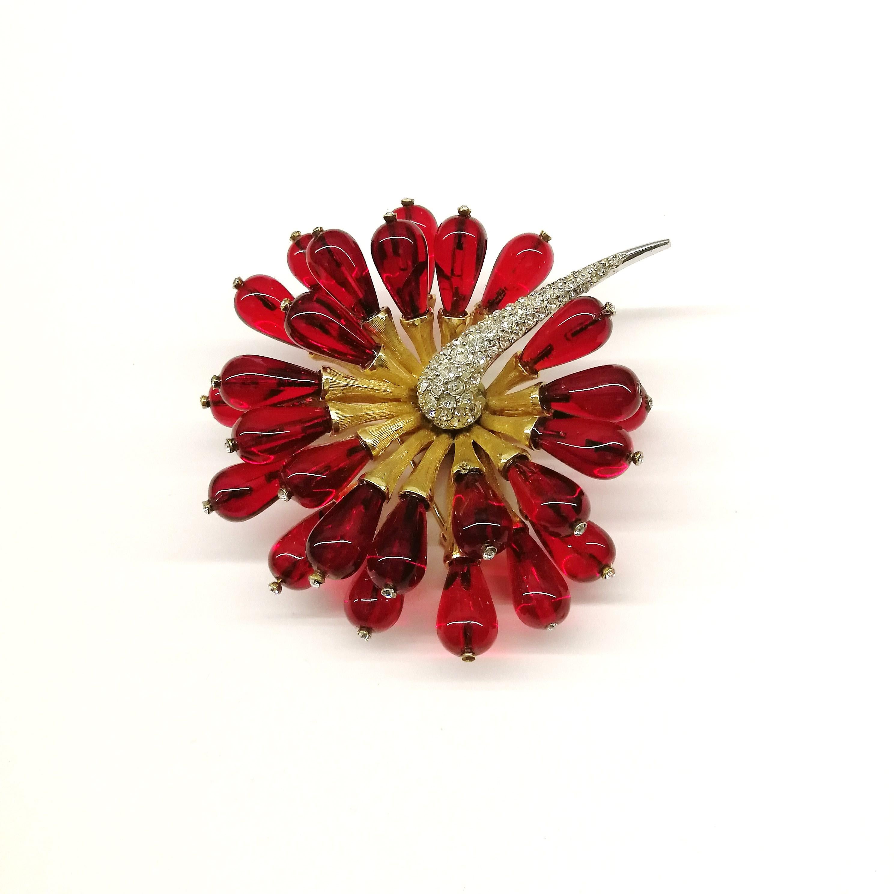A highly dynamic and very striking brooch and earrings from Marcel Boucher, in the most perfect colour, deep ruby red, each 'petal' tipped with a single paste, each in its own setting, and a serpentine paste stem. As with many Boucher designs, there