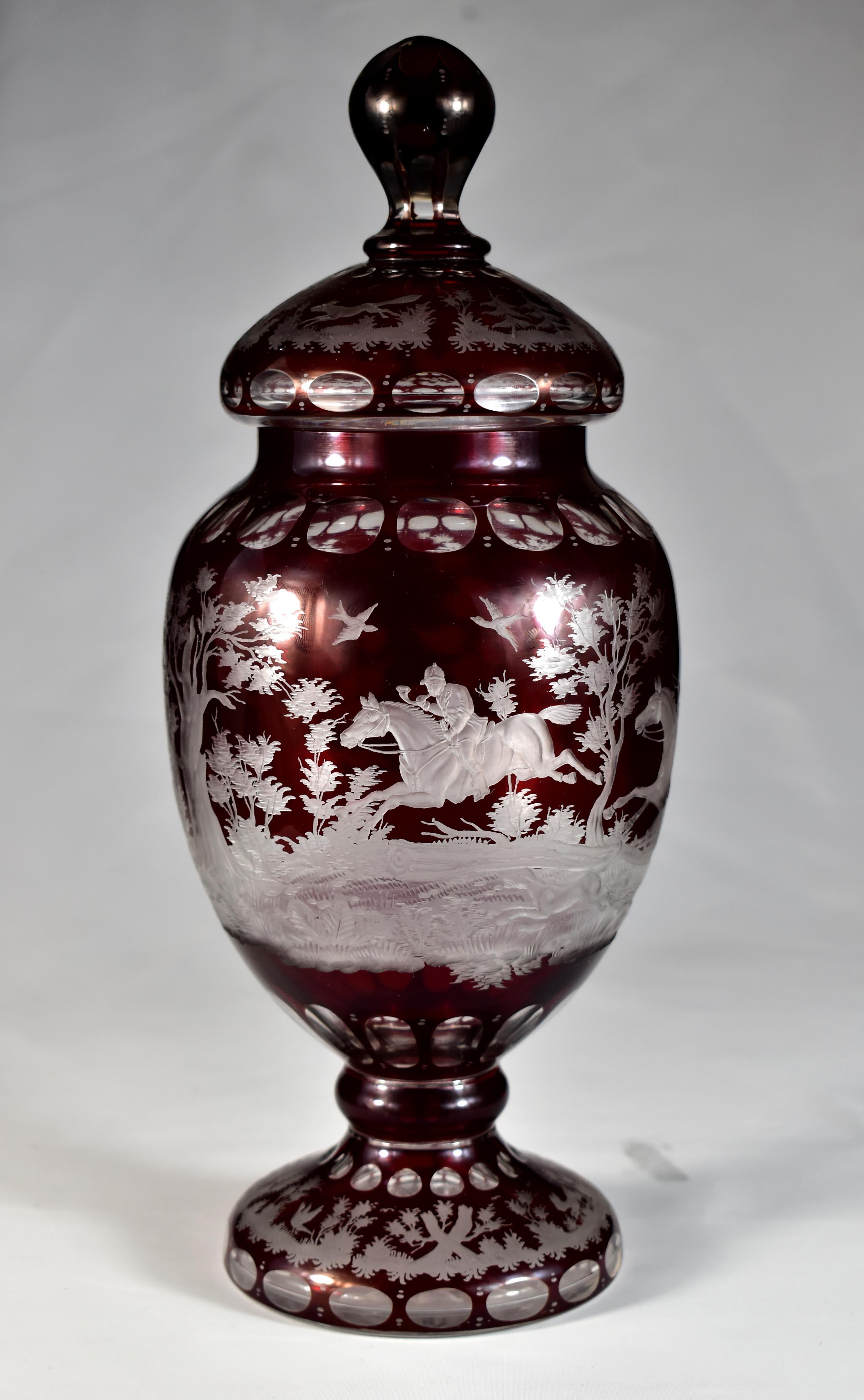 Beautiful engraved and cut goblet with lid, clear glass with ruby lazure. This is a wonderful handiwork of Czech glassmakers, probably from the first half of the 20th century. This is a clear hand blown goblet with lid and  a ruby lazure overlay.
